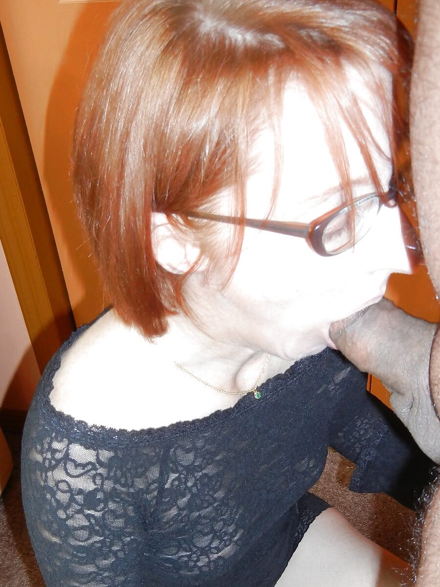 Mature redhead Layla is sucking dick