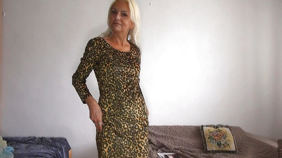 Sexy blonde mature undressing and opening her pussy wide