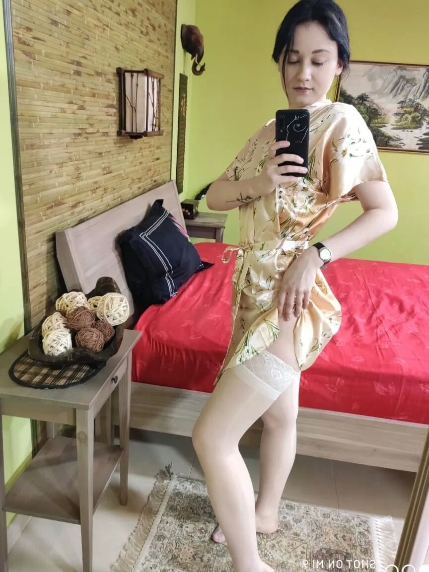Cute babe posing in her white stockings