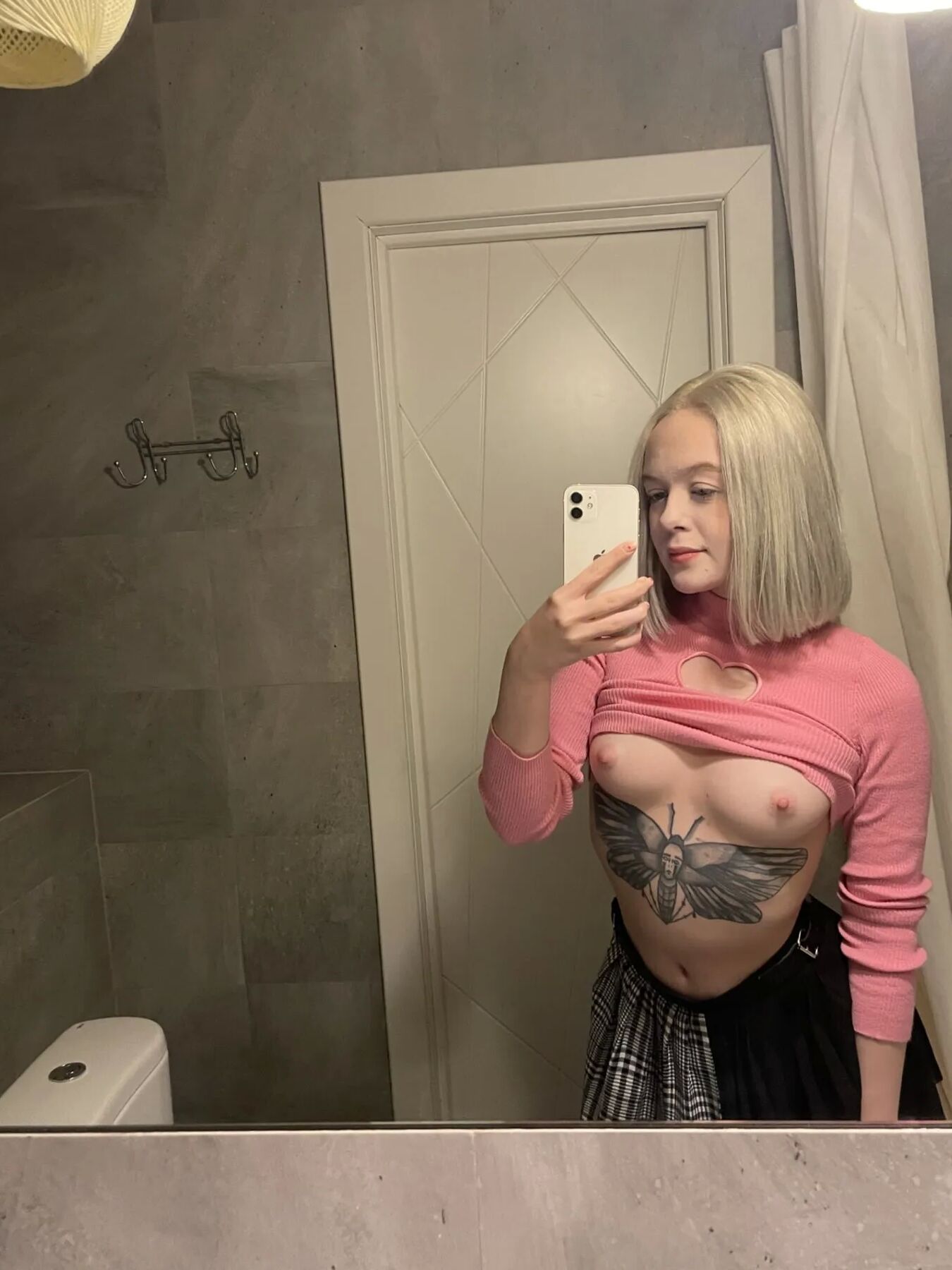 Tattooed blonde showing off her sexy tattoos