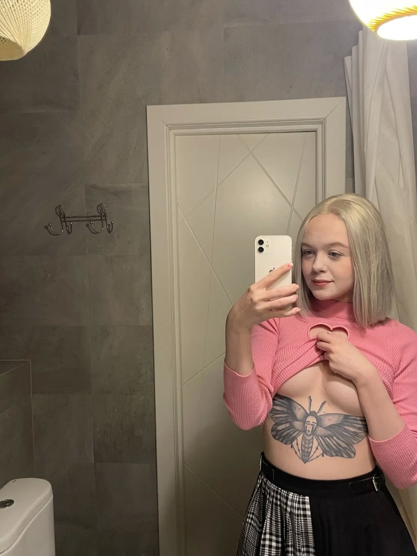 Tattooed blonde showing off her sexy tattoos