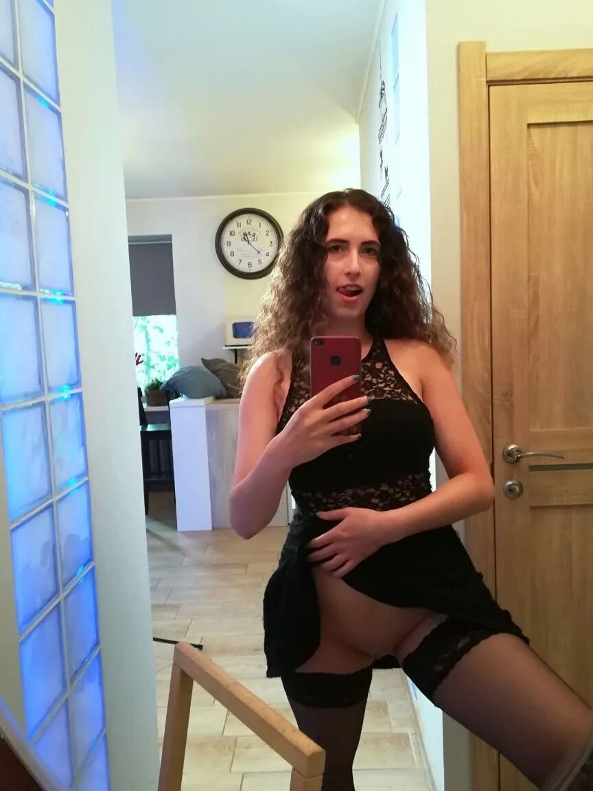 Cutie with curly brunette hair shows her tits