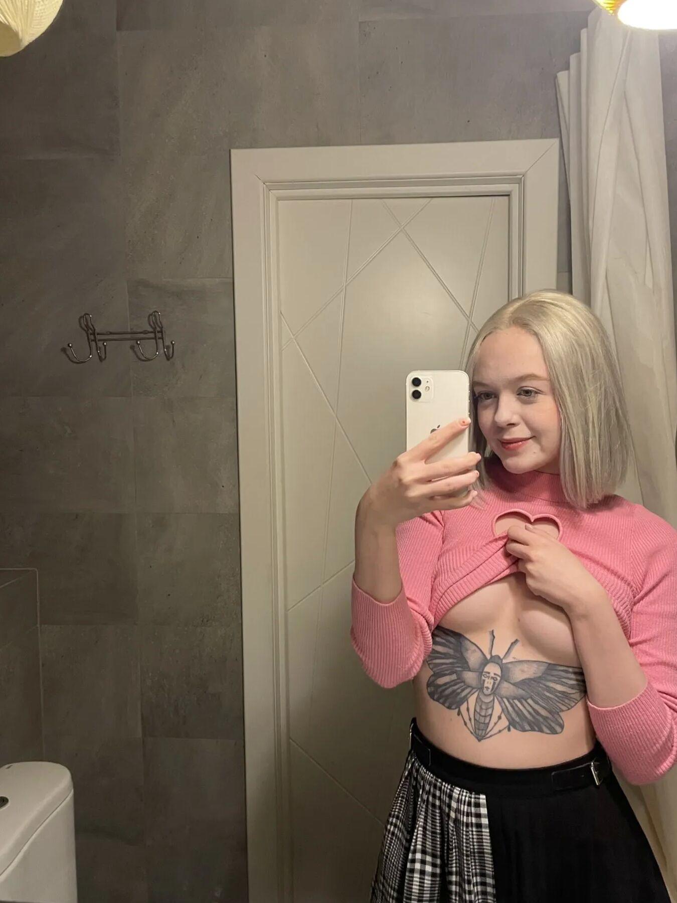 Tattooed blonde showing off her sexy tattoos