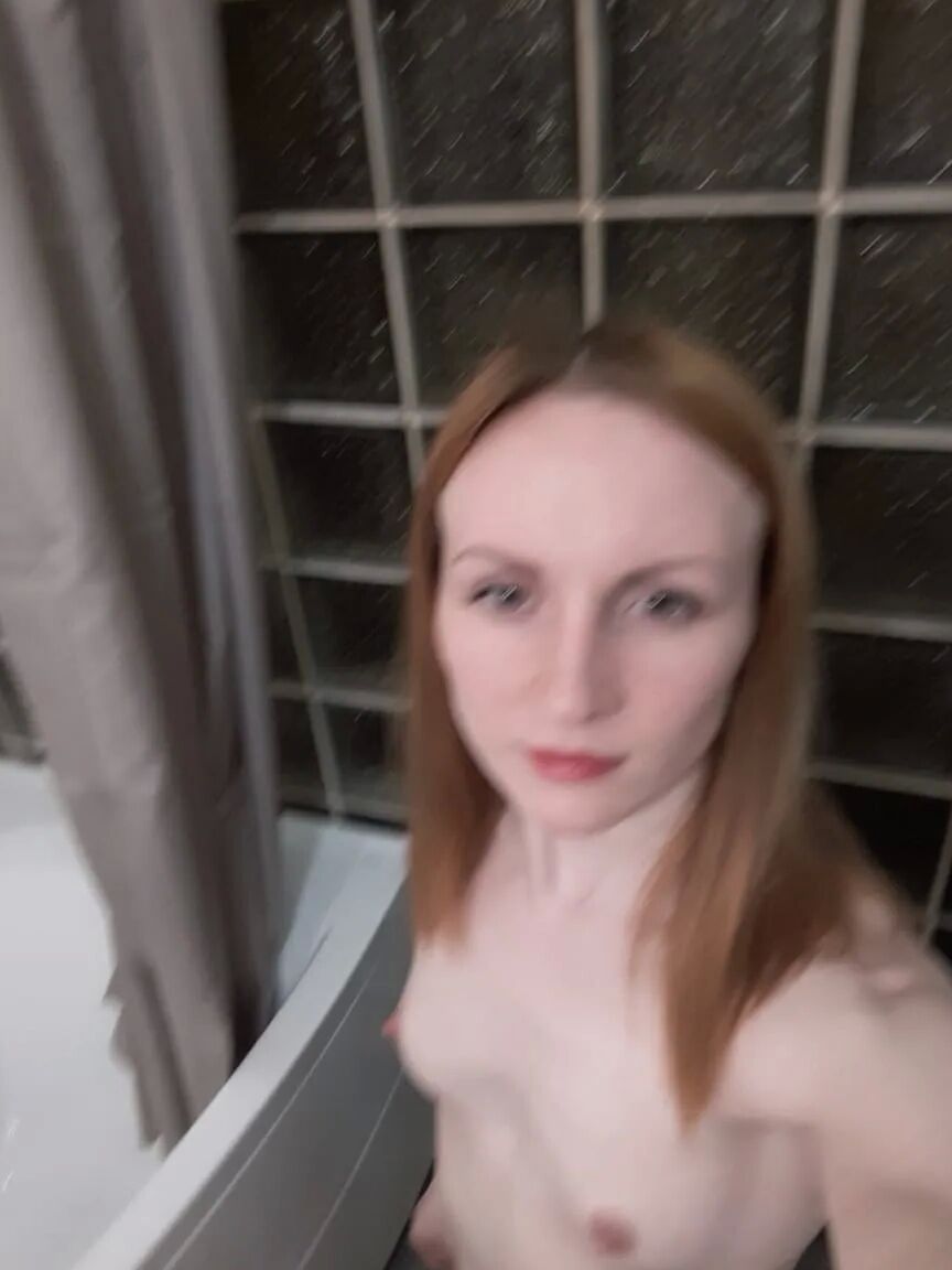 Skinny redhead girl posing in her bathroom naked