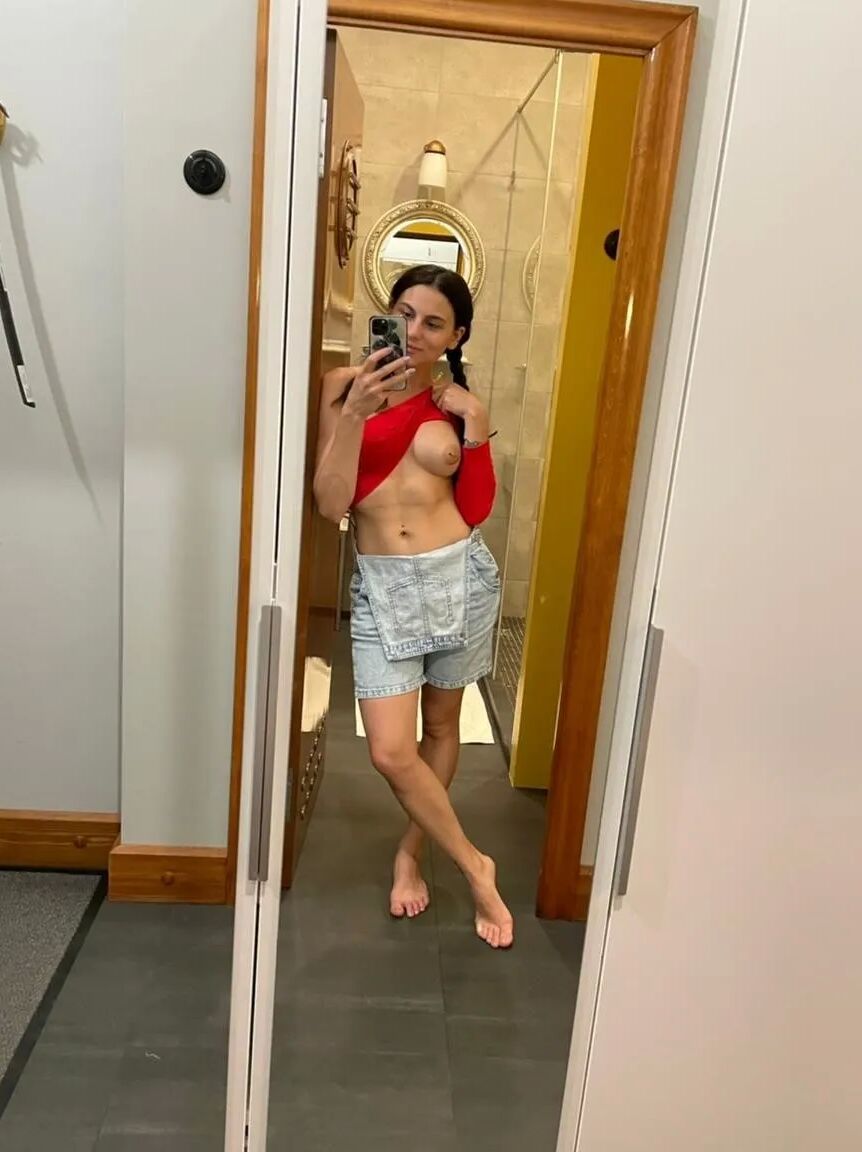 Sexy girl in red gets naked for you