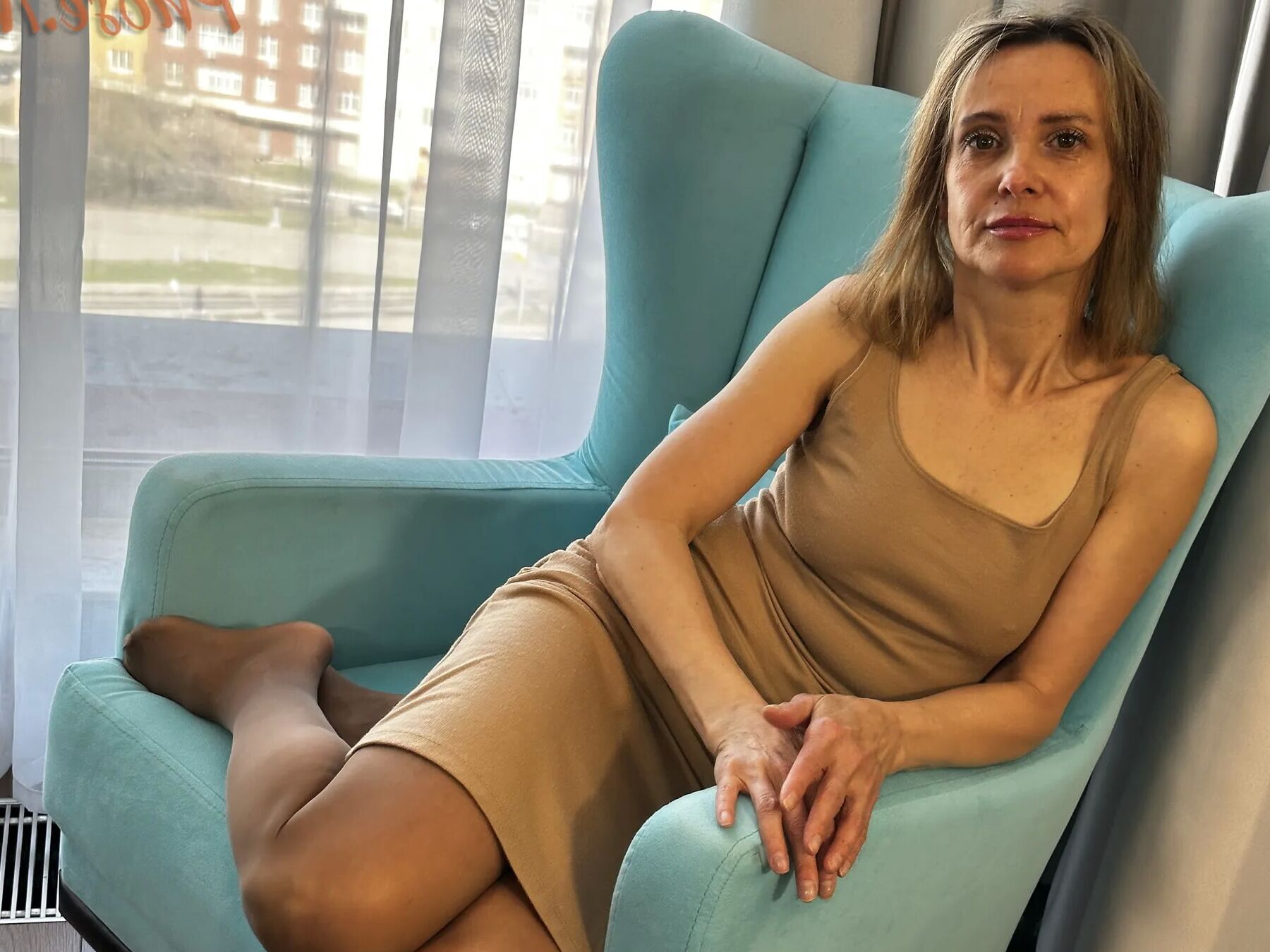 Gerda Ice in Brown Dress and Pantyhose