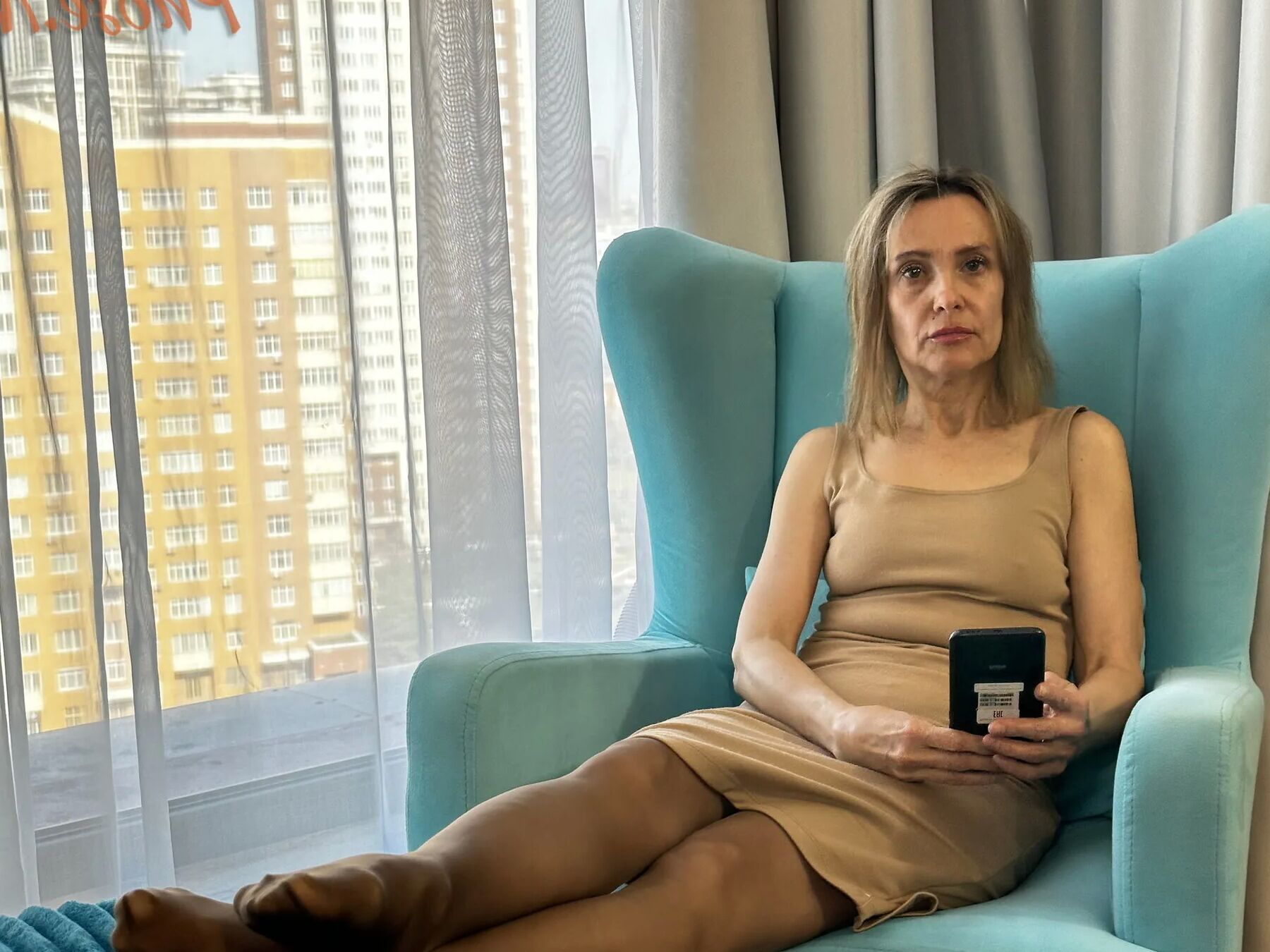 Gerda Ice in Brown Dress and Pantyhose