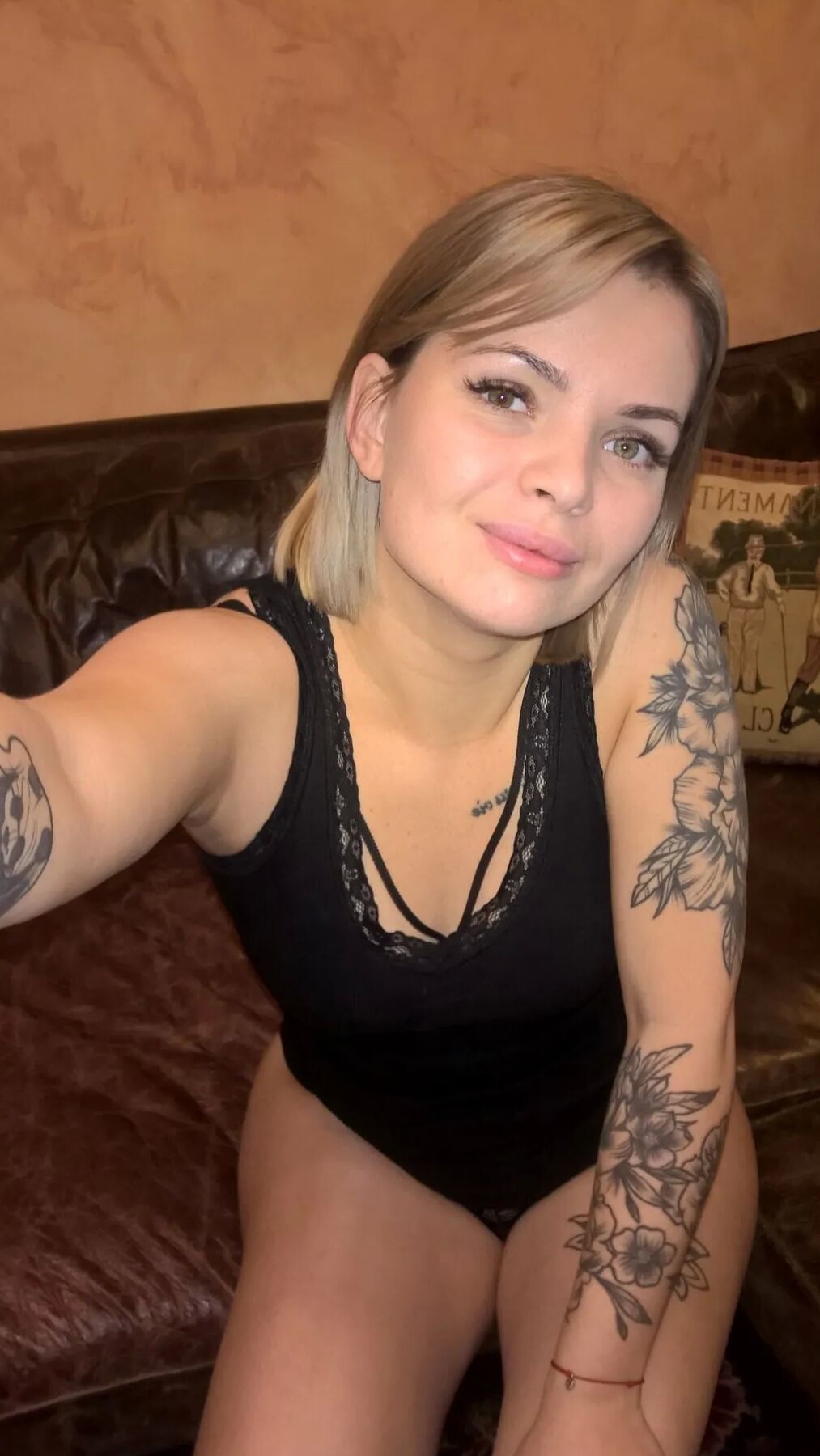 Short-haired hottie shows her small perky tits