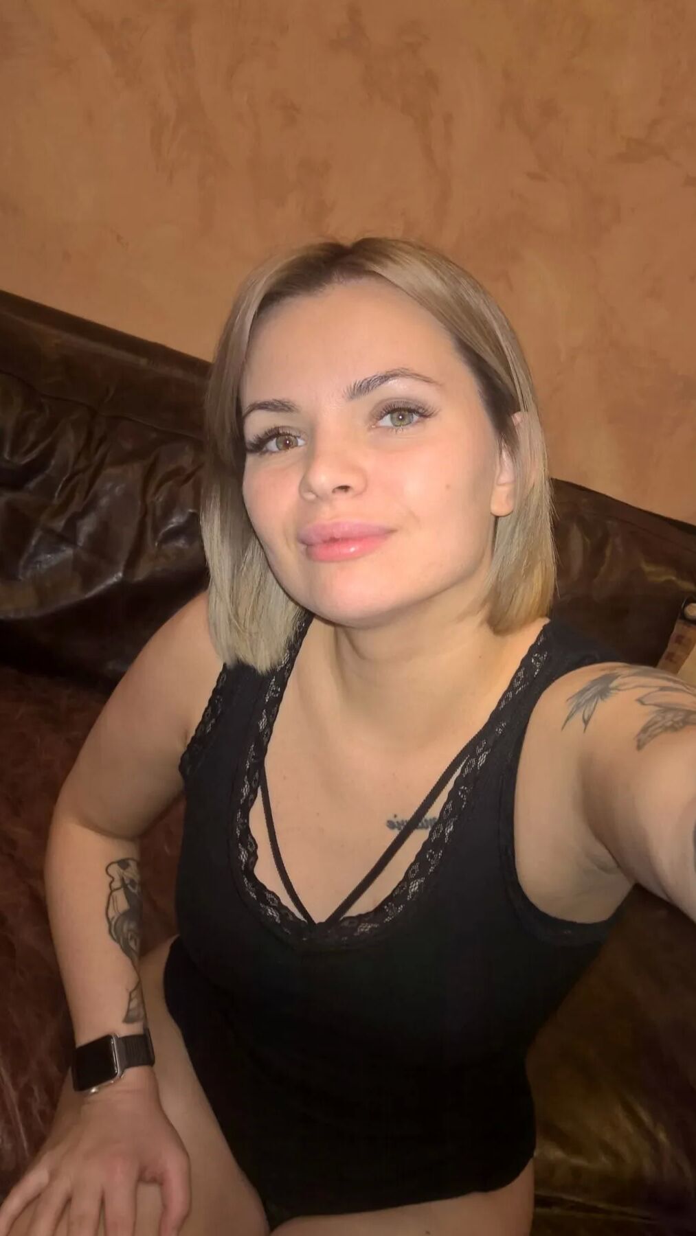 Short-haired hottie shows her small perky tits