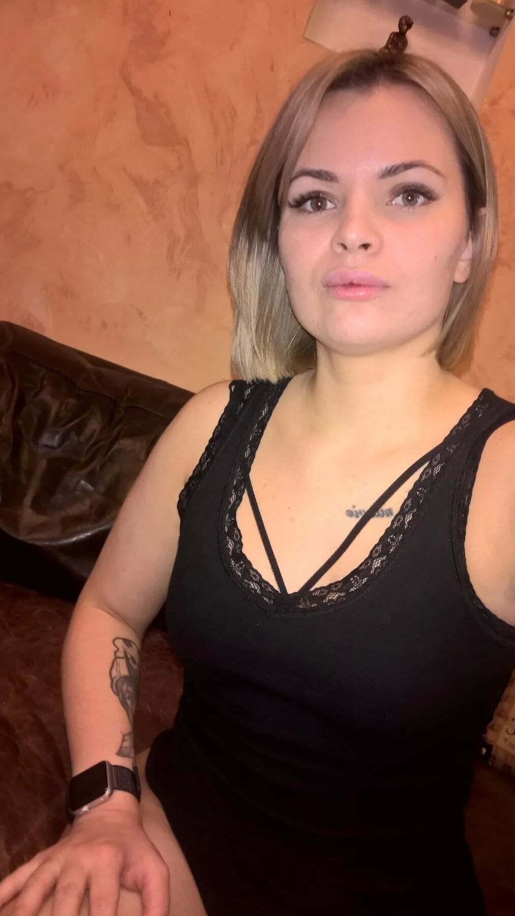 Short-haired hottie shows her small perky tits