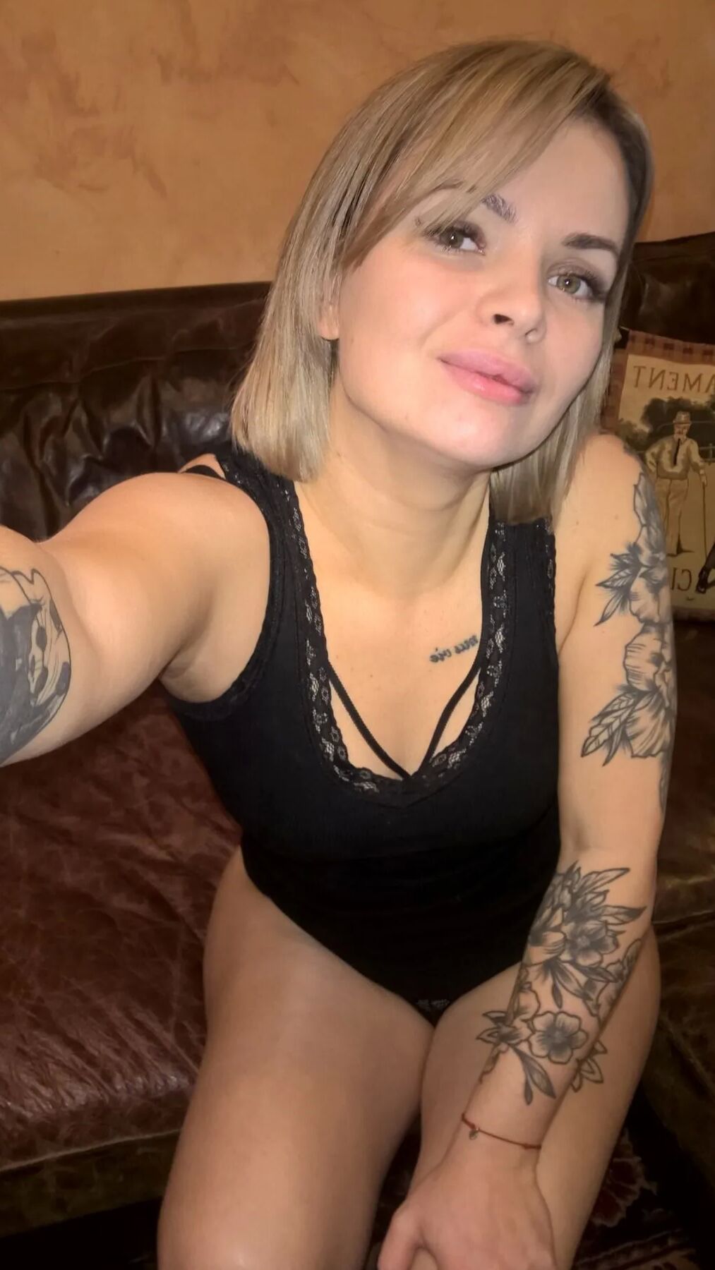 Short-haired hottie shows her small perky tits