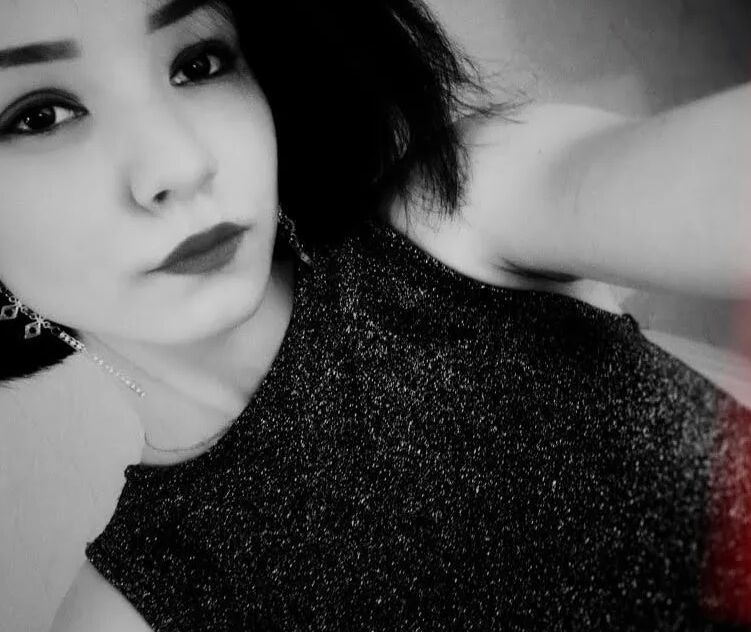 Dark-haired cutie gets naked and poses for you