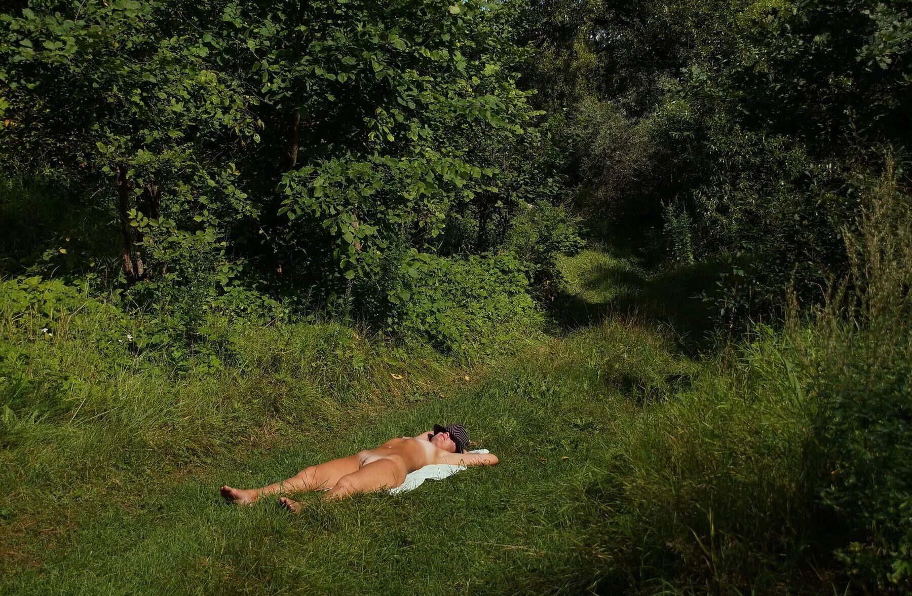 Nude on green grass