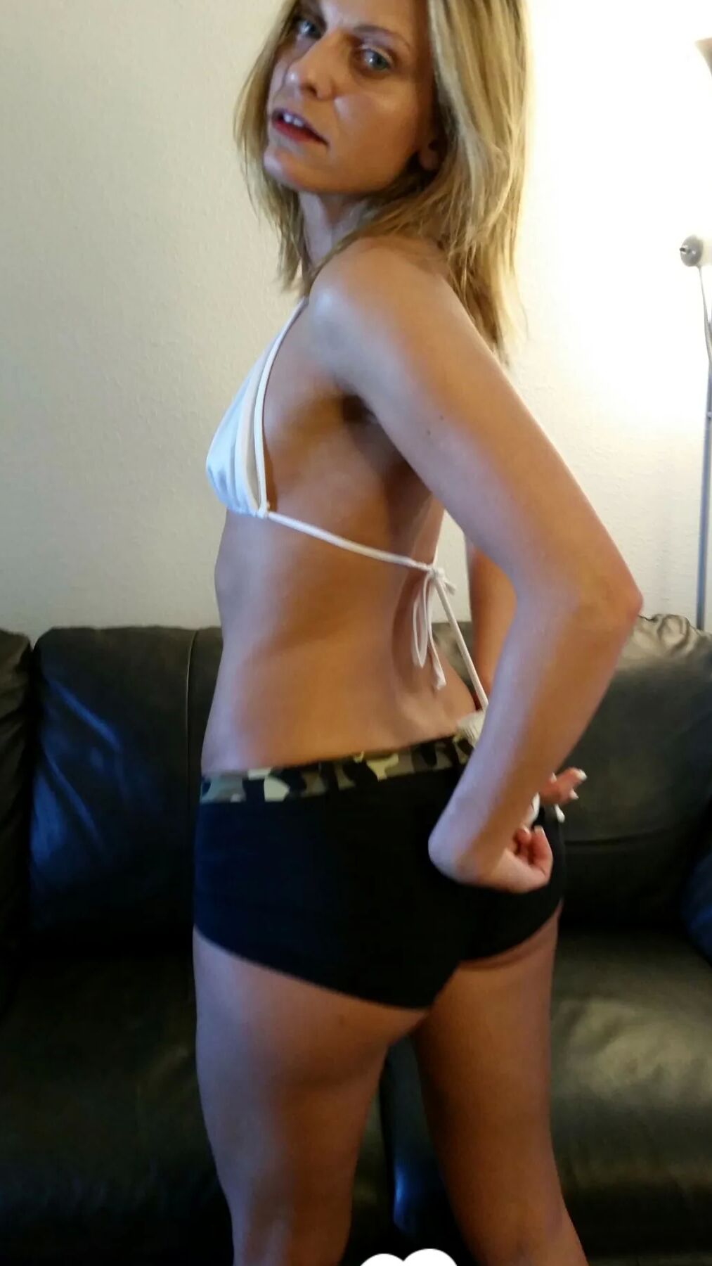 Tattooed blonde gets recorded while teasing herself