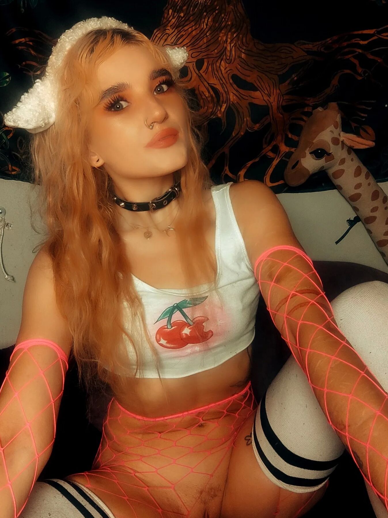 Being a treat in fishnet, thigh highs, pink cosplay