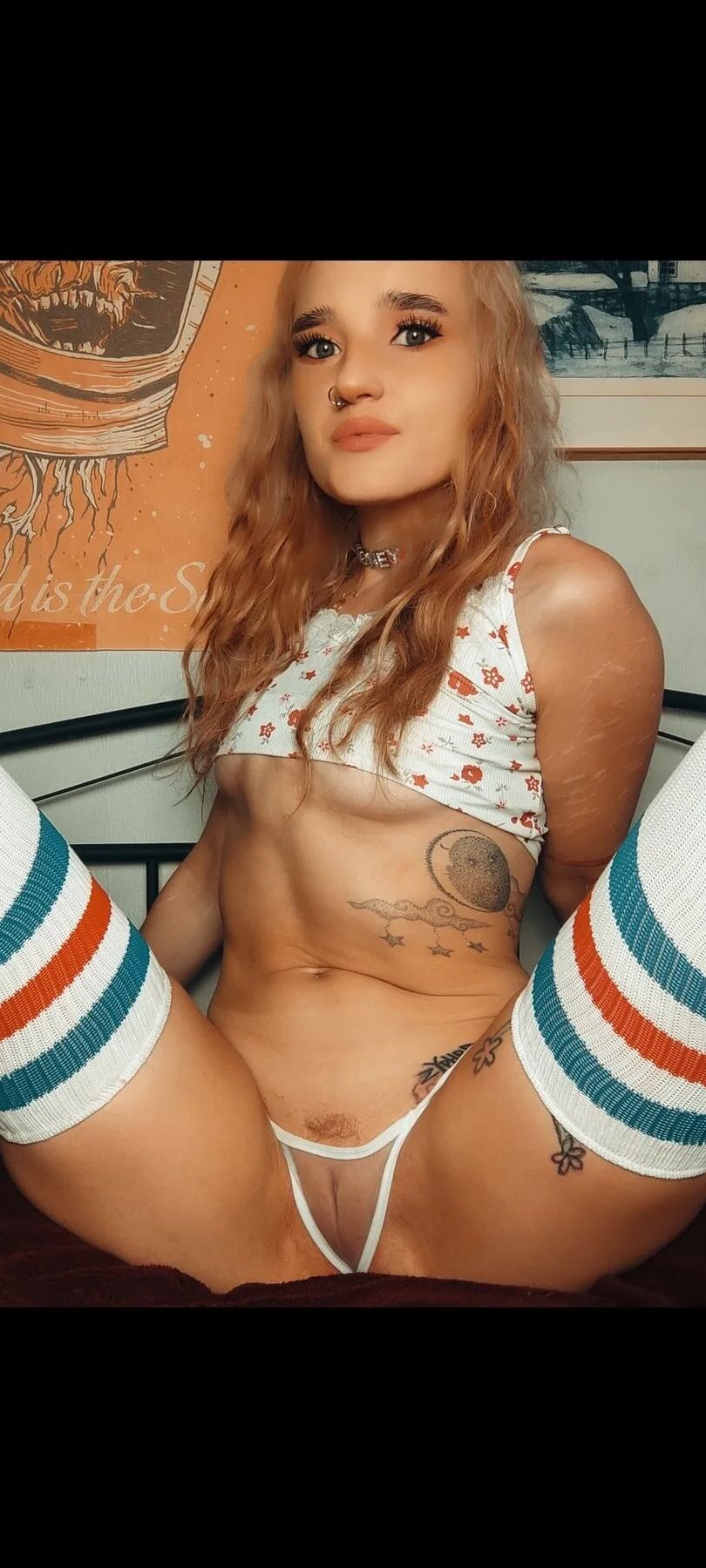 Moonchild spreading her legs in a see-through thong