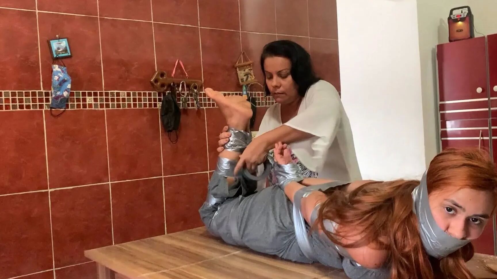 Hogtaped Student Lectured With Foot Whipping In Tape Bondage
