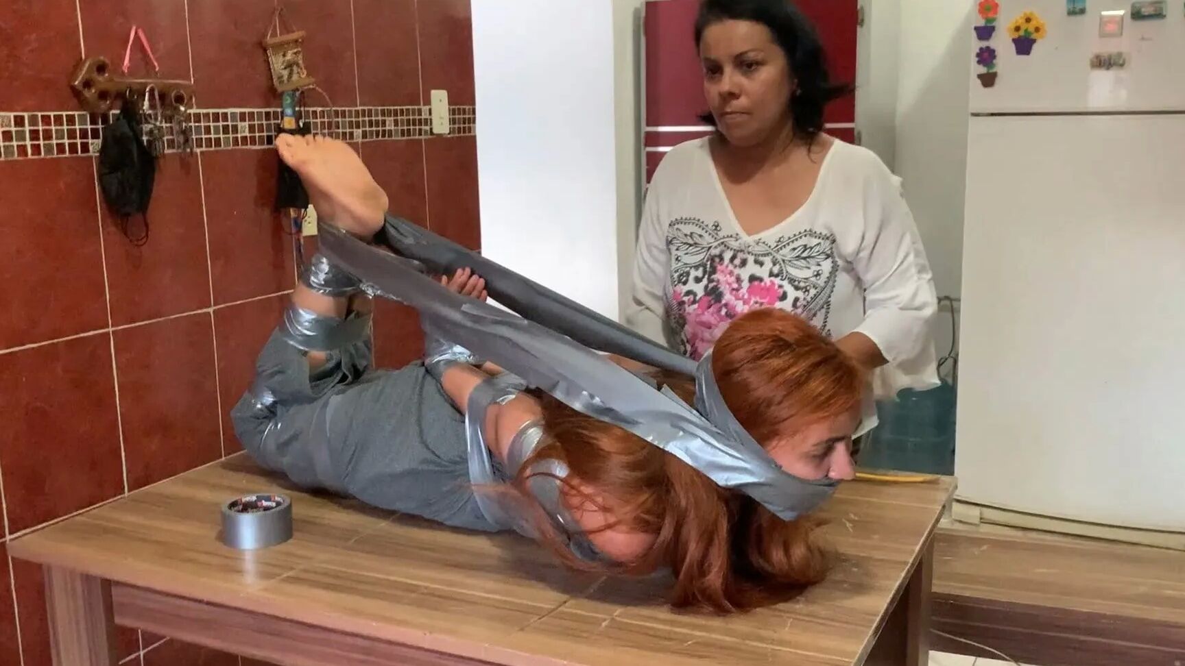 Hogtaped Student Lectured With Foot Whipping In Tape Bondage