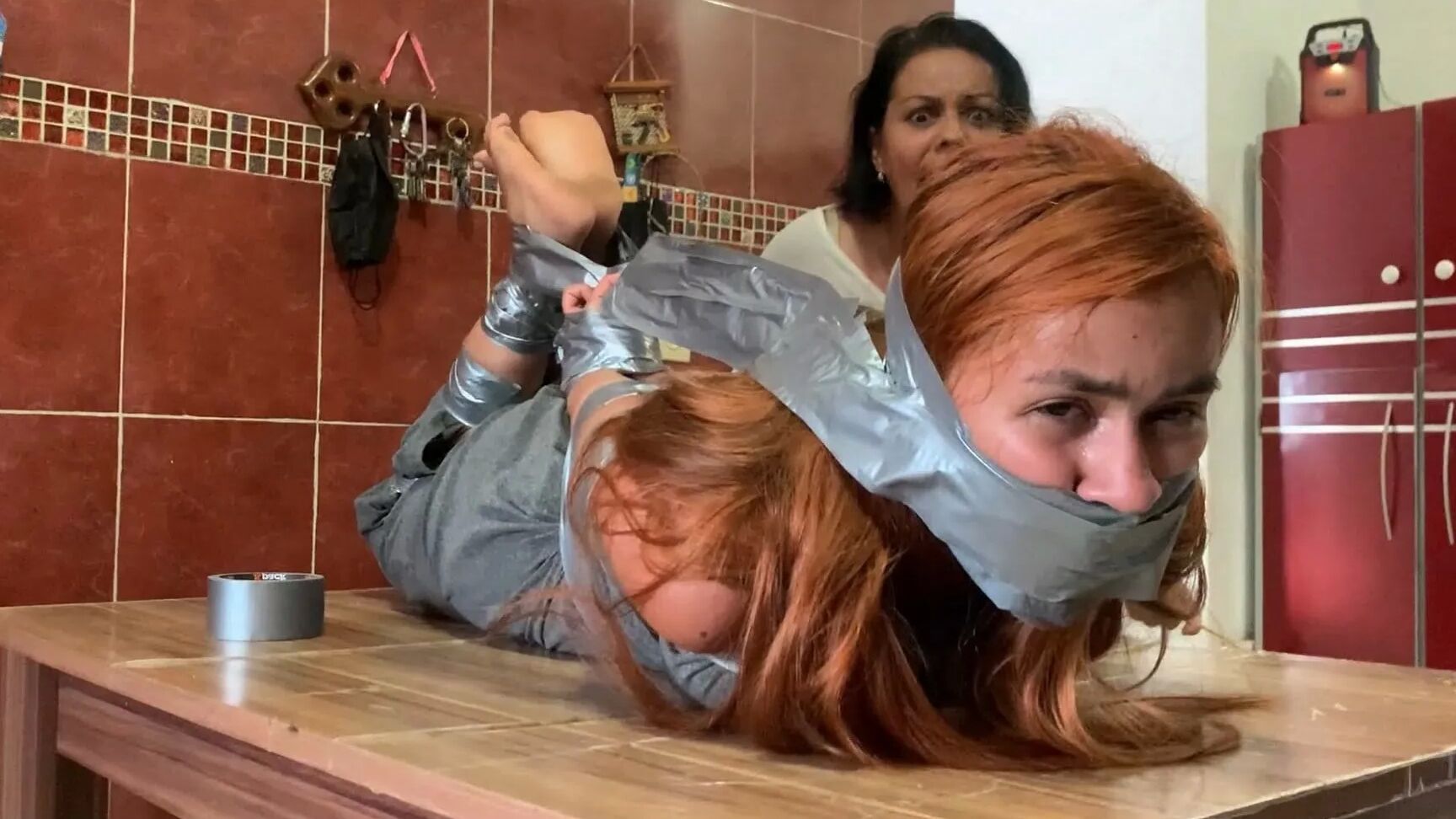 Hogtaped Student Lectured With Foot Whipping In Tape Bondage