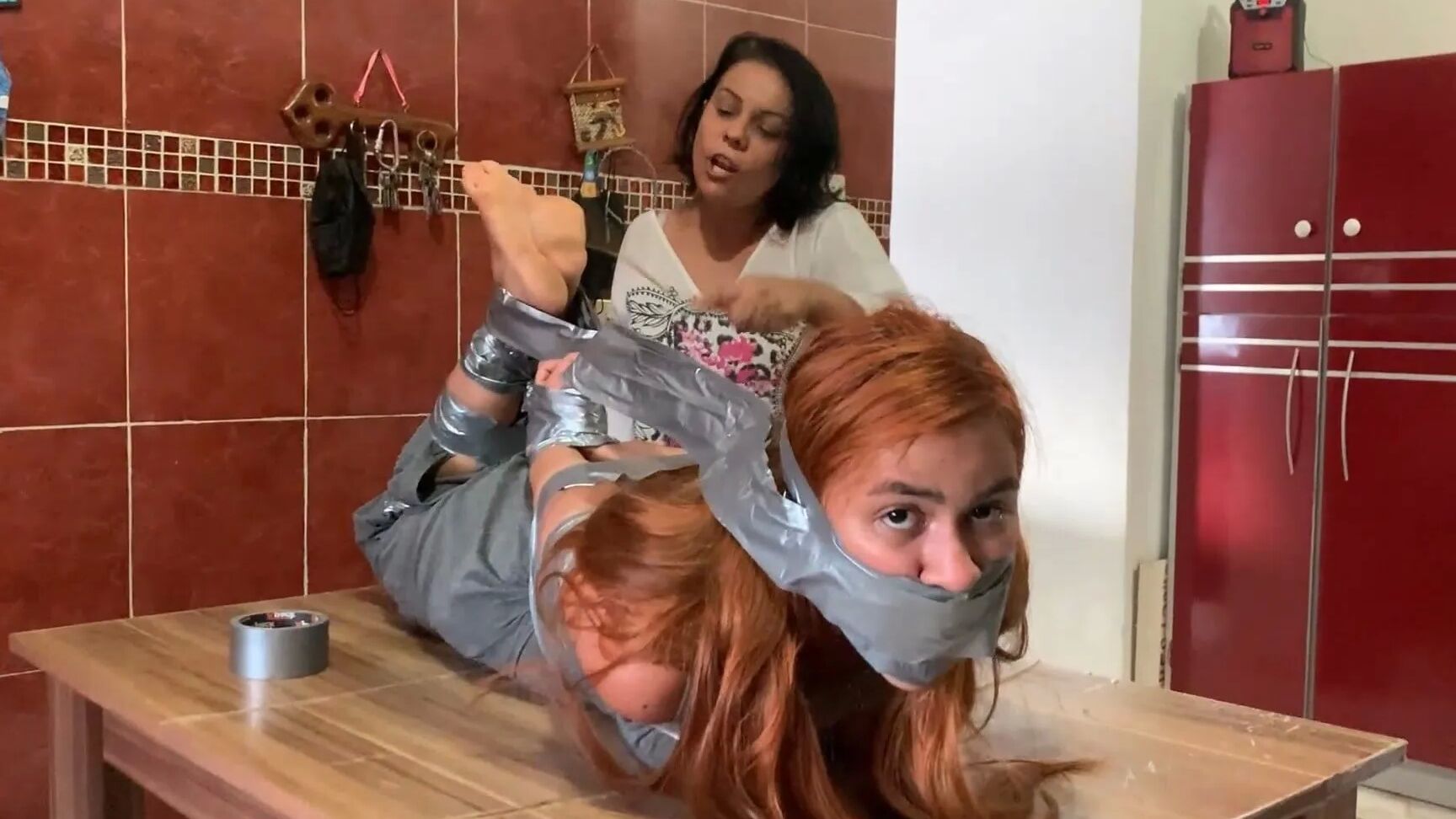 Hogtaped Student Lectured With Foot Whipping In Tape Bondage
