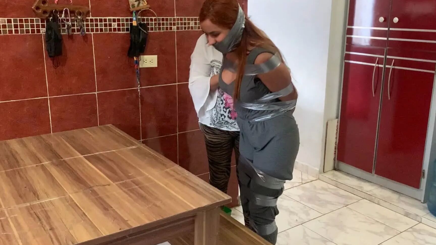 Hogtaped Student Lectured With Foot Whipping In Tape Bondage