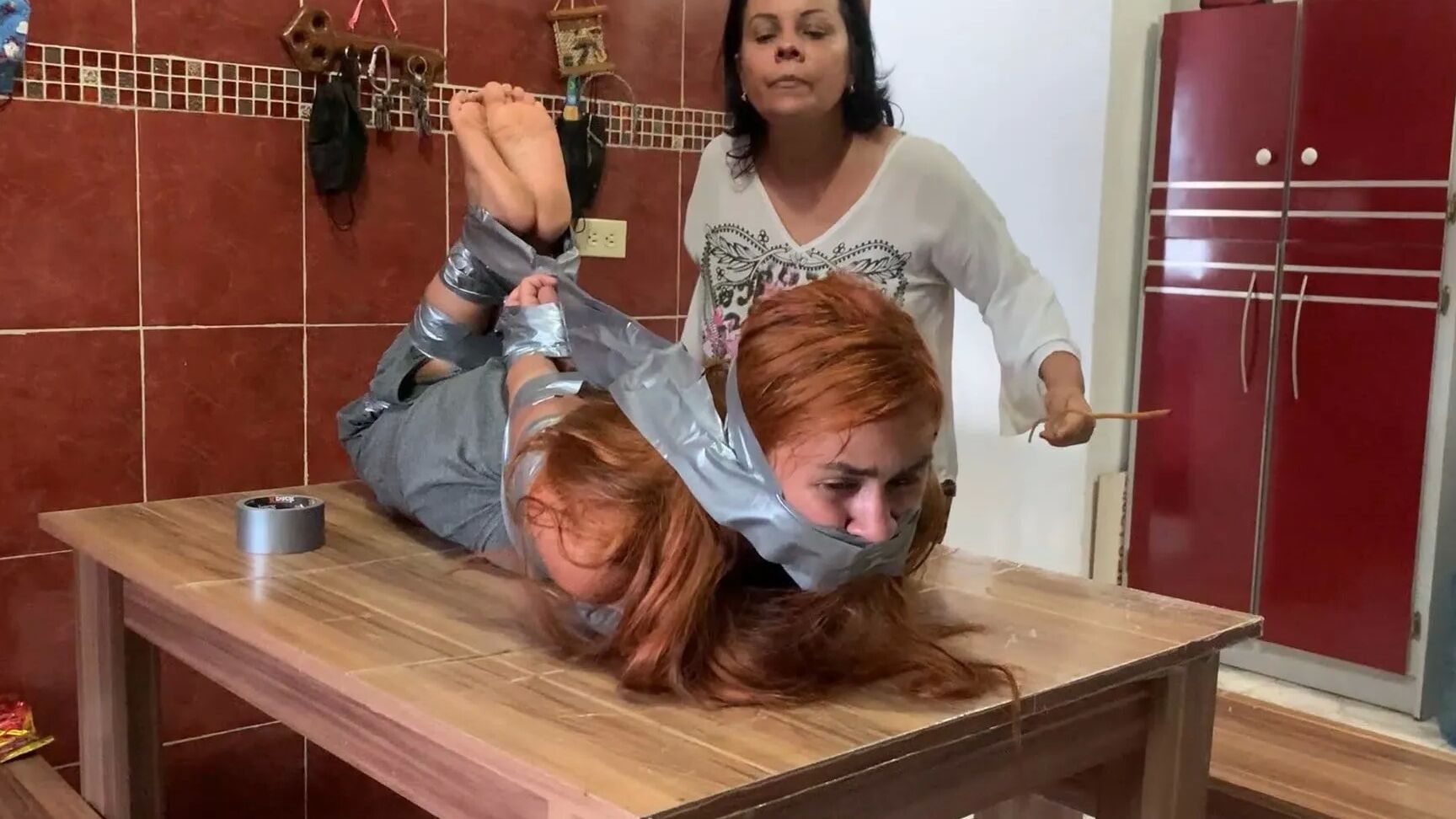 Hogtaped Student Lectured With Foot Whipping In Tape Bondage