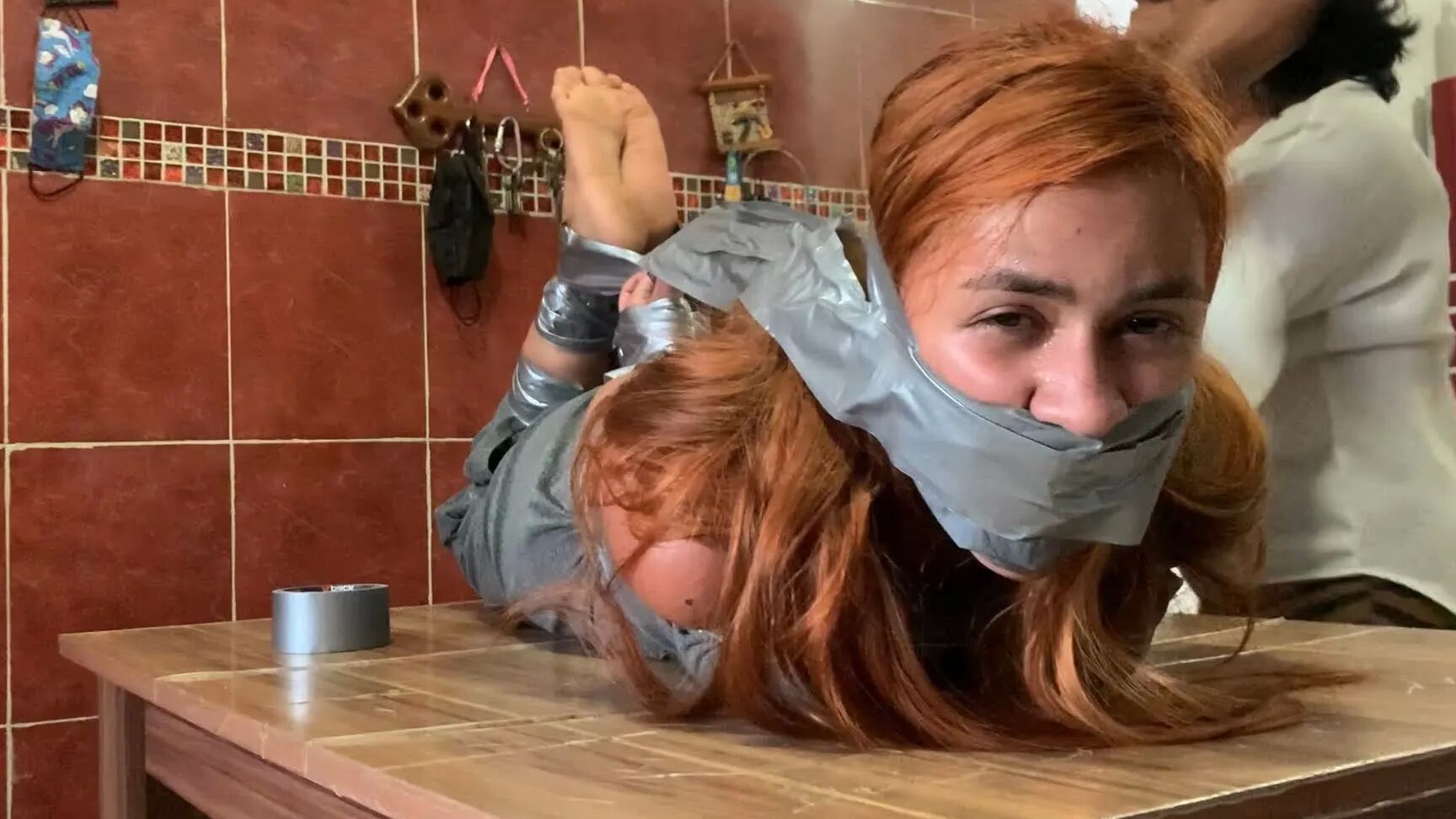 Hogtaped Student Lectured With Foot Whipping In Tape Bondage
