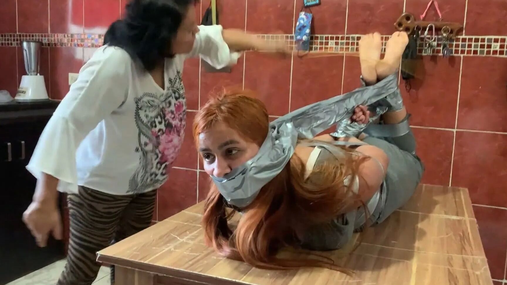 Hogtaped Student Lectured With Foot Whipping In Tape Bondage