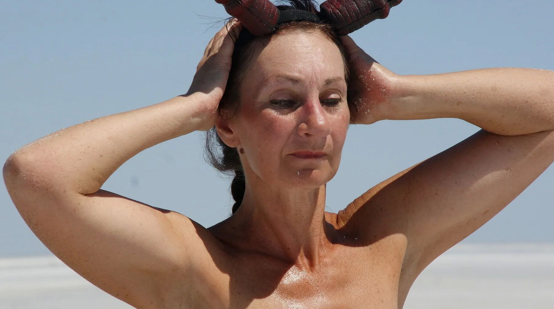 Standing naked on the salt of the salt lake Elton