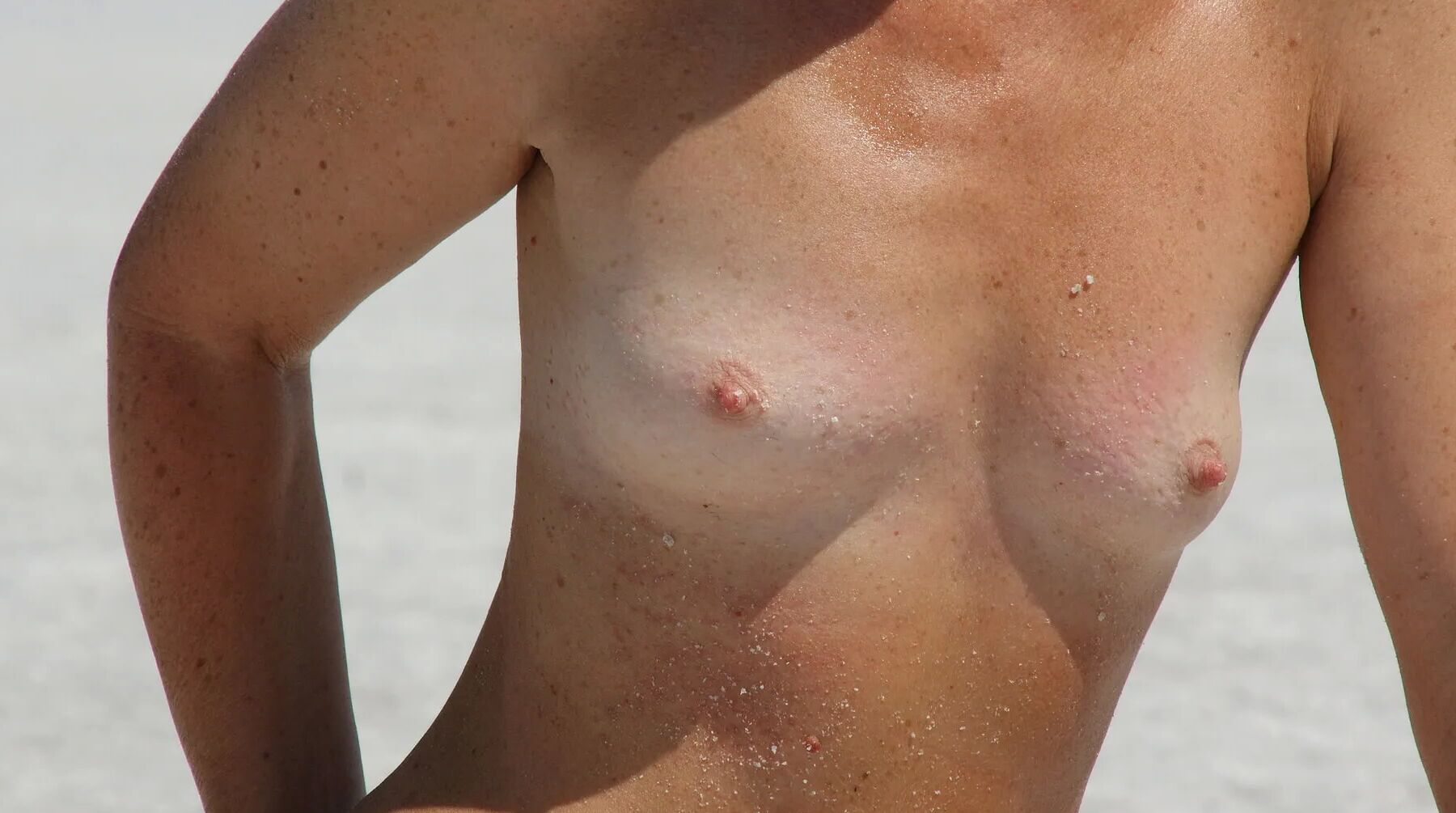Standing naked on the salt of the salt lake Elton