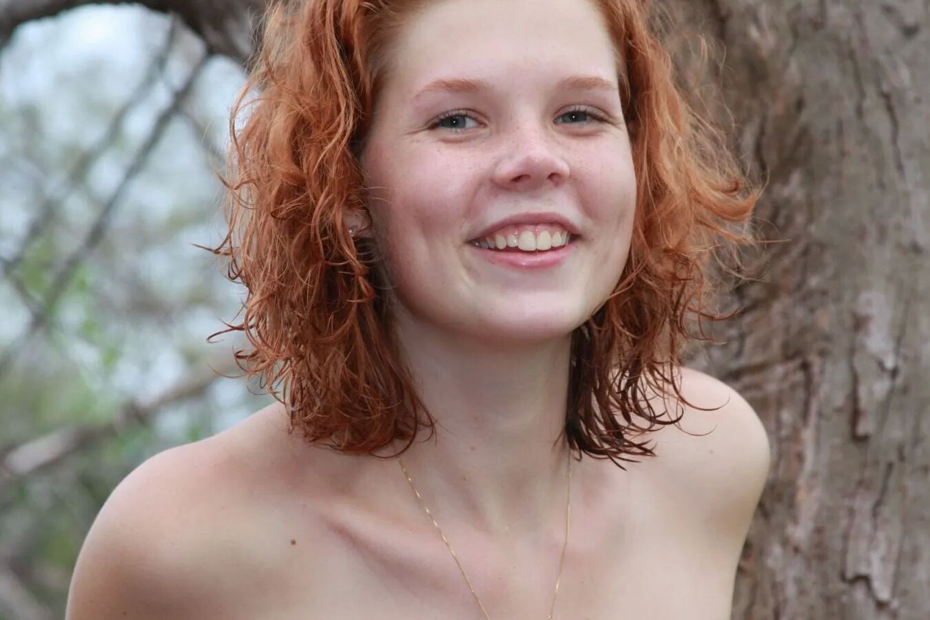 Gorgeous freckled redhead Tori posing nude in the beach