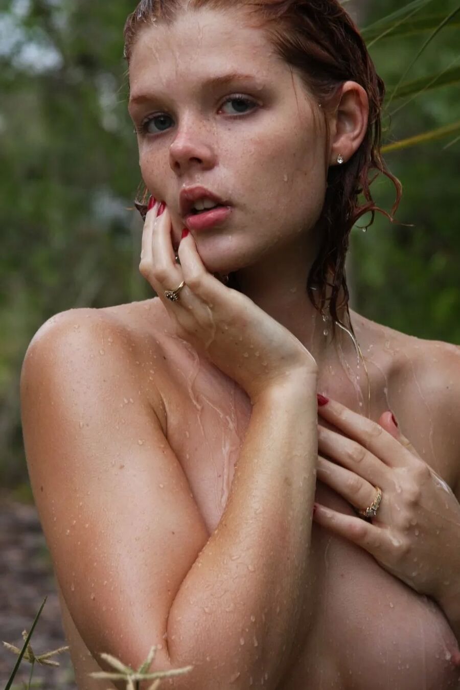 Gorgeous freckled redhead Tori posing nude in the beach