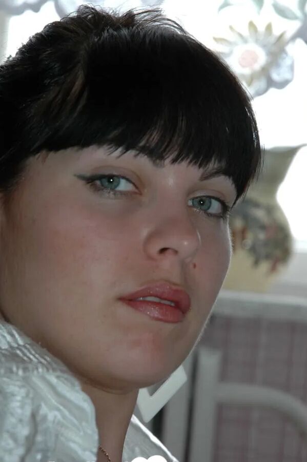 Smoking mom in stockings showing off her legs