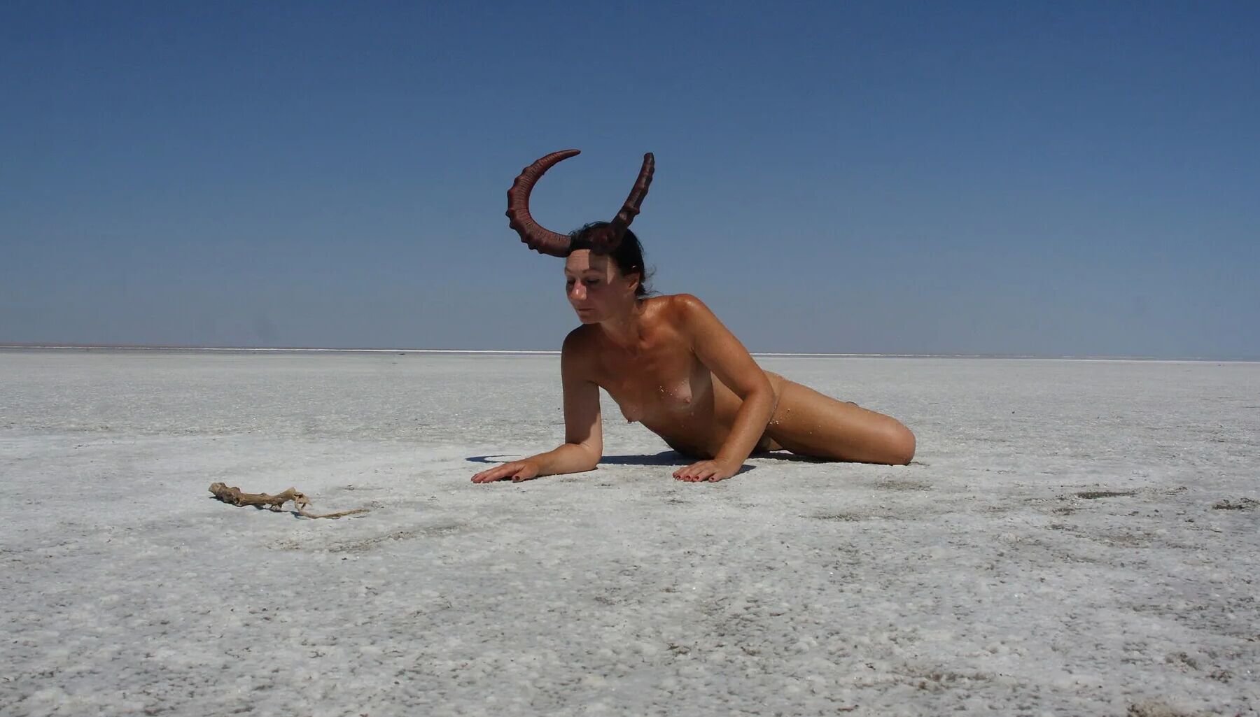 Standing on laps naked on the salt of the salt lake Elton