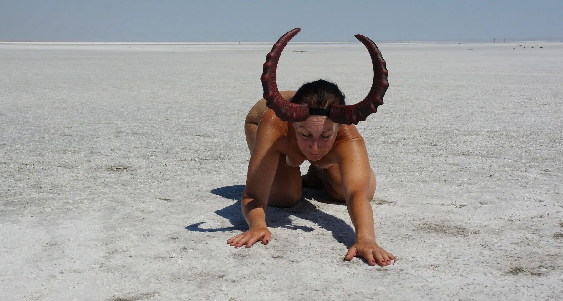 Standing on laps naked on the salt of the salt lake Elton