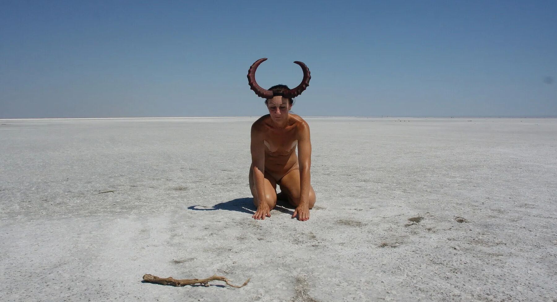 Standing on laps naked on the salt of the salt lake Elton