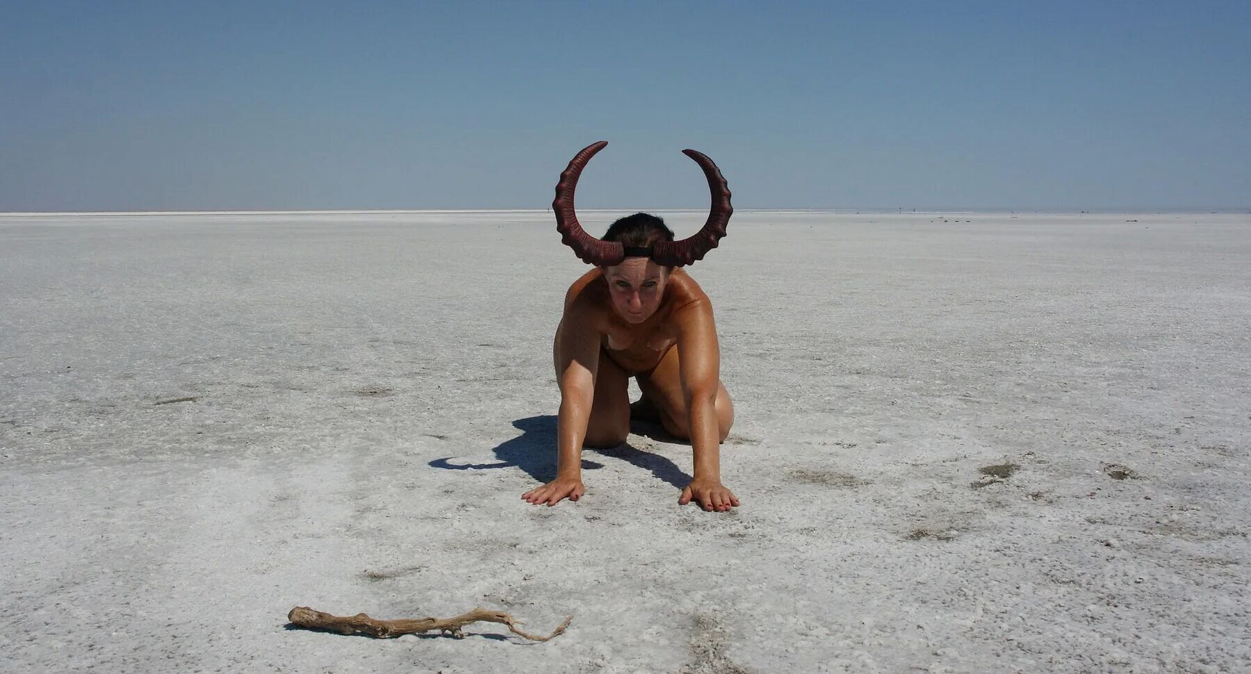 Standing on laps naked on the salt of the salt lake Elton