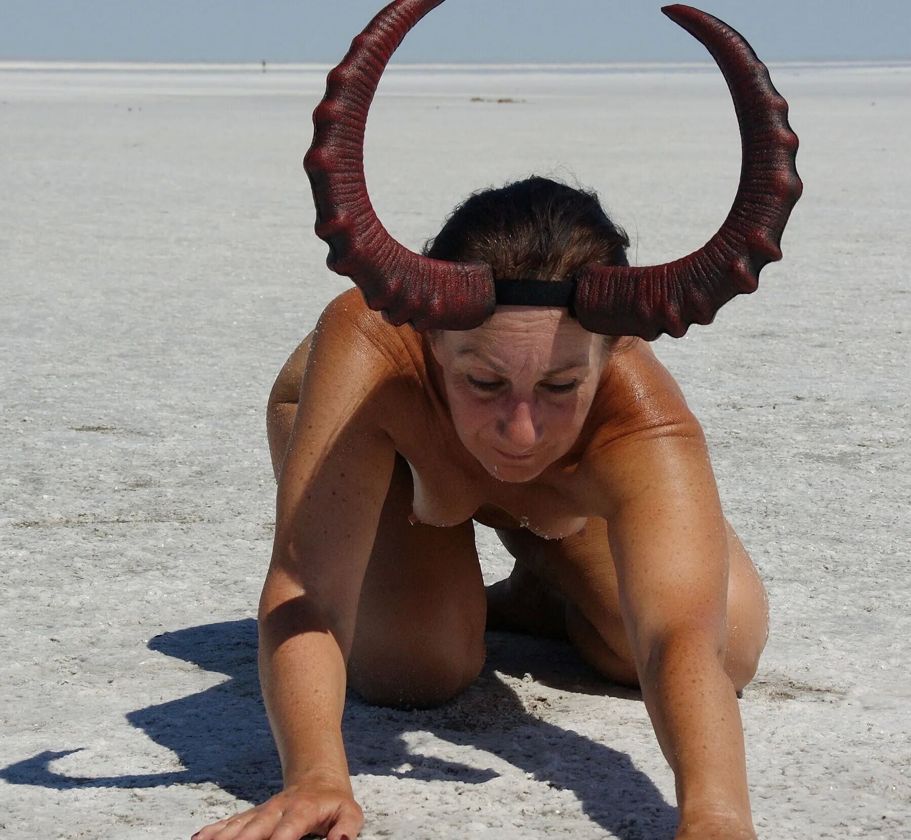 Standing on laps naked on the salt of the salt lake Elton