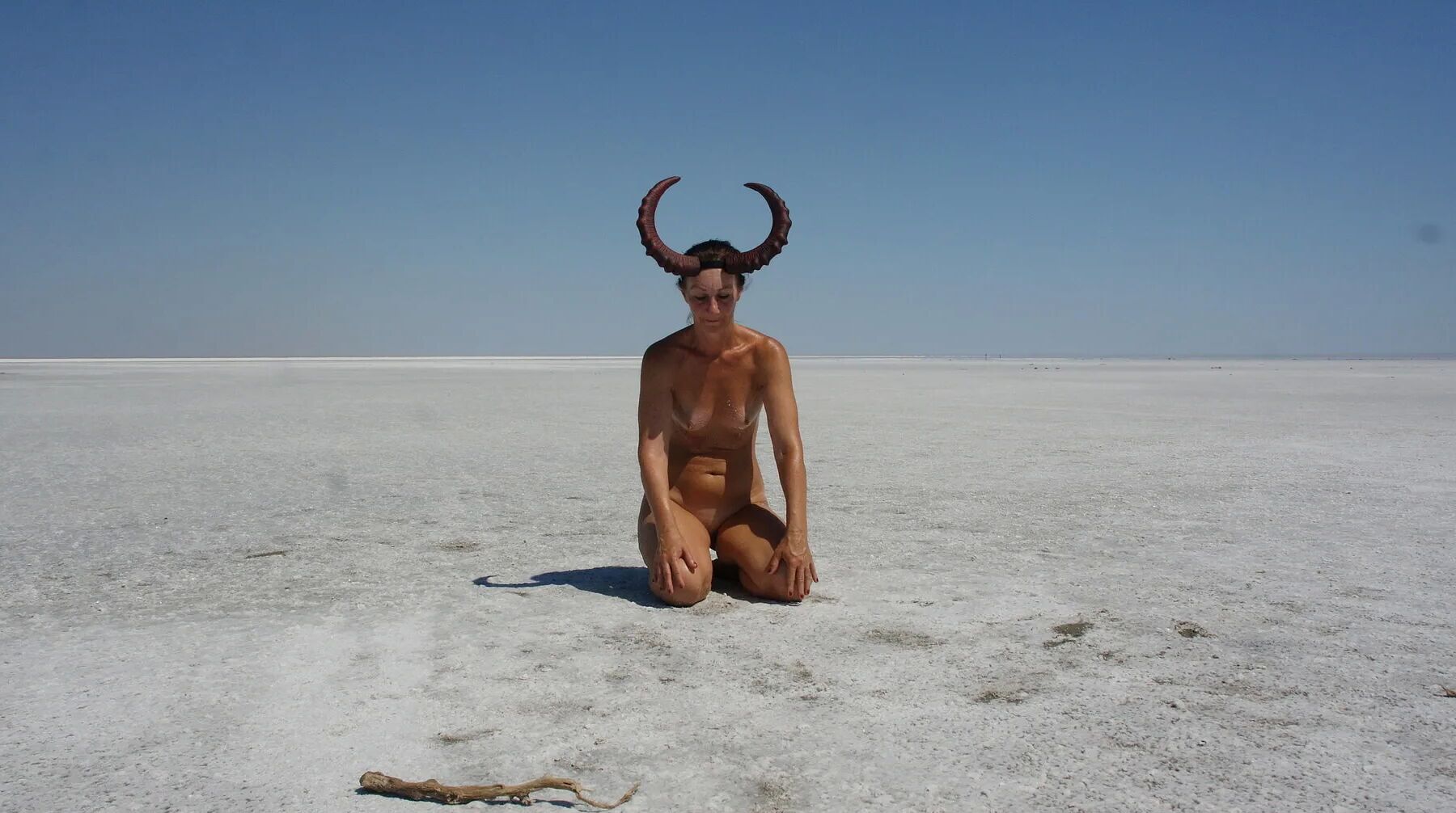Standing on laps naked on the salt of the salt lake Elton