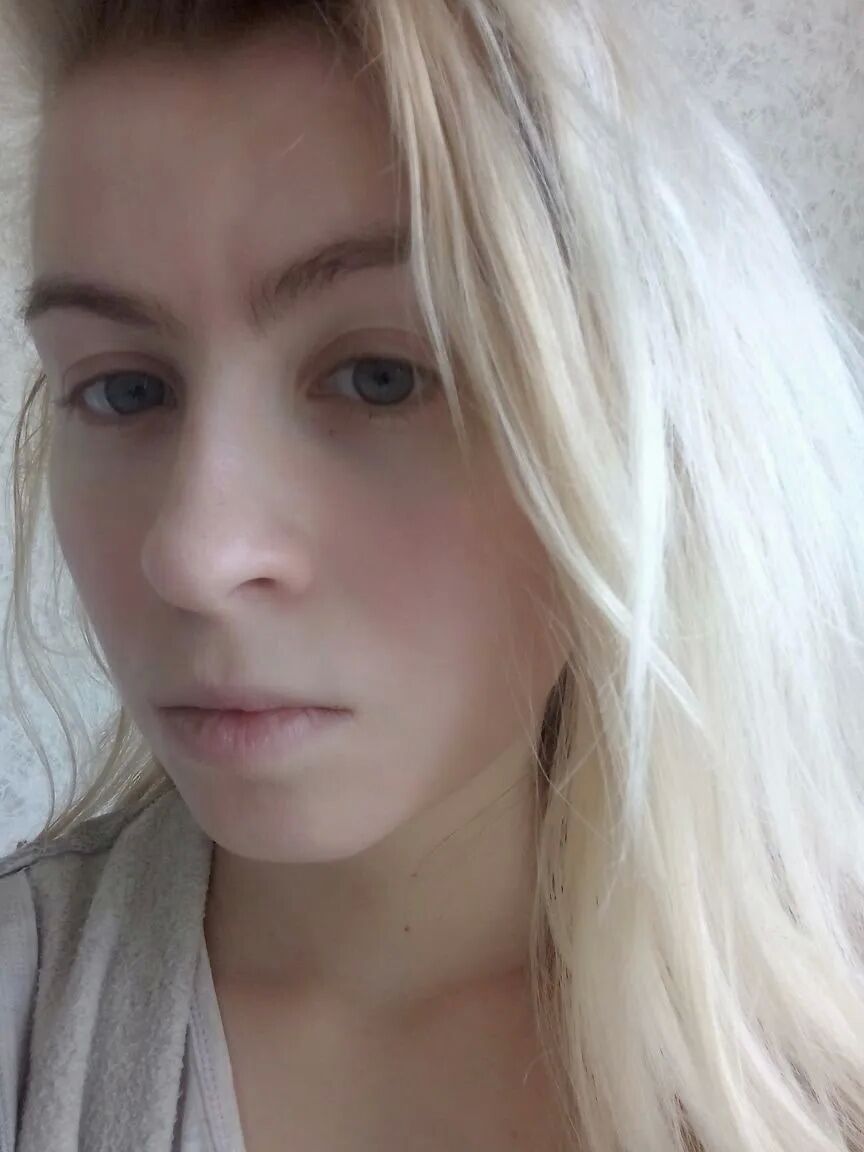 Blue eyed beauty shows off her tiny tits