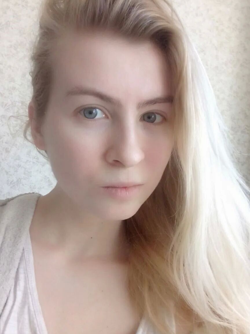 Blue eyed beauty shows off her tiny tits