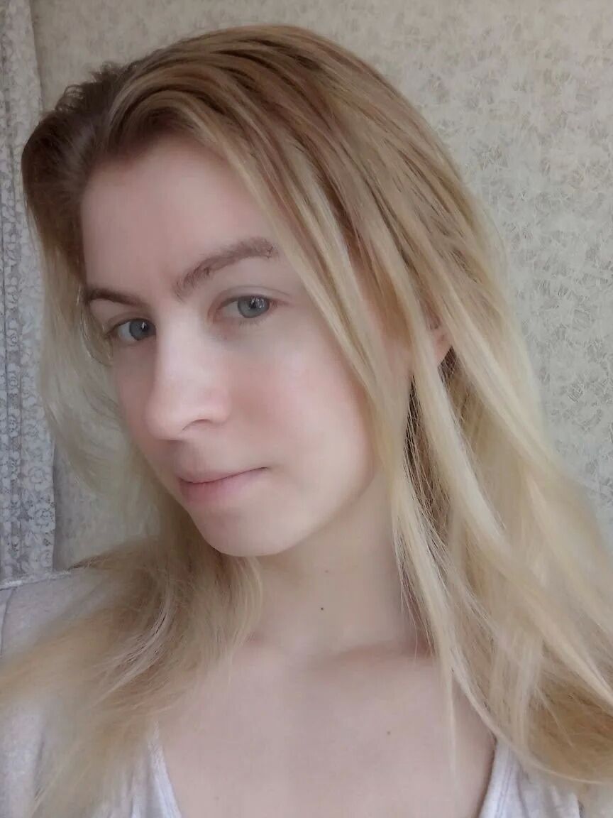 Blue eyed beauty shows off her tiny tits