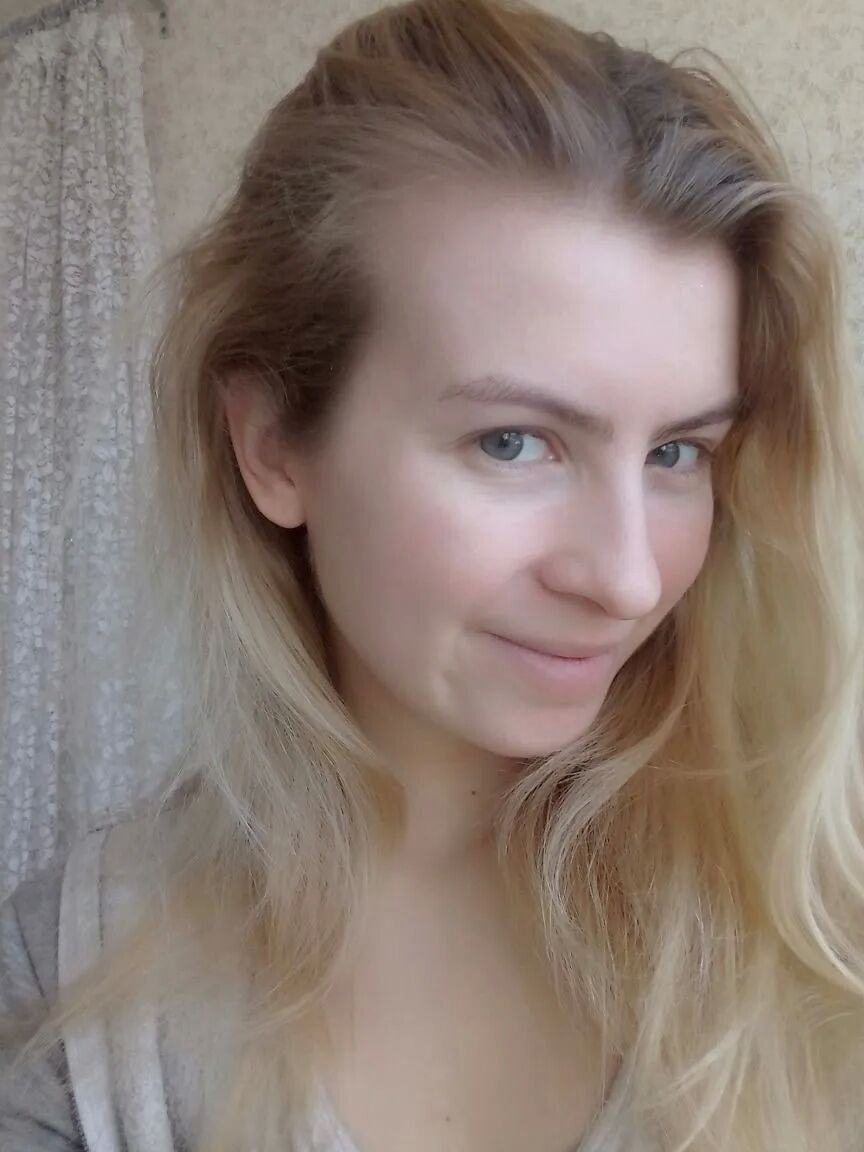 Blue eyed beauty shows off her tiny tits