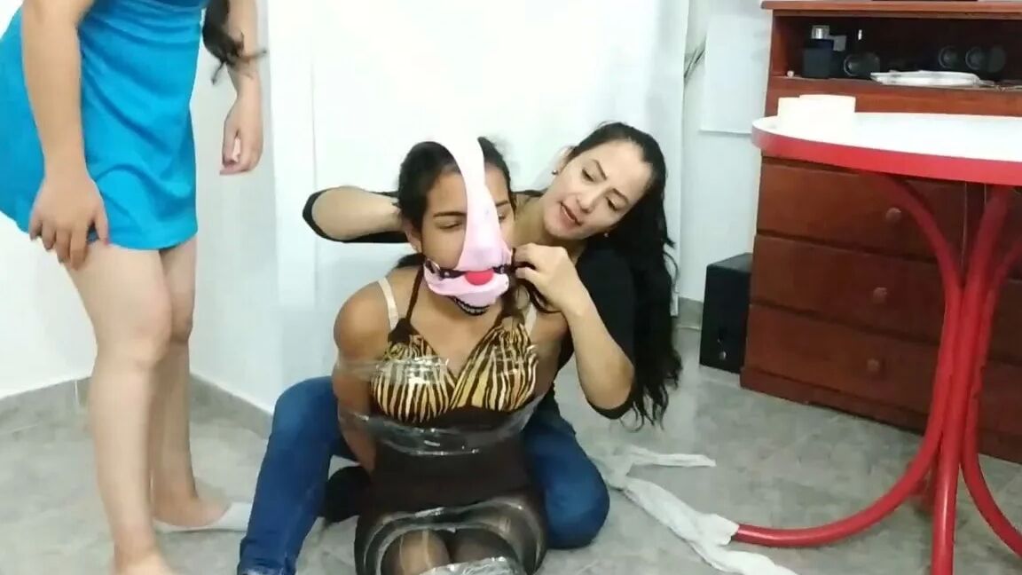 Hogtied Girl Panty Hooded And Ball Gagged
