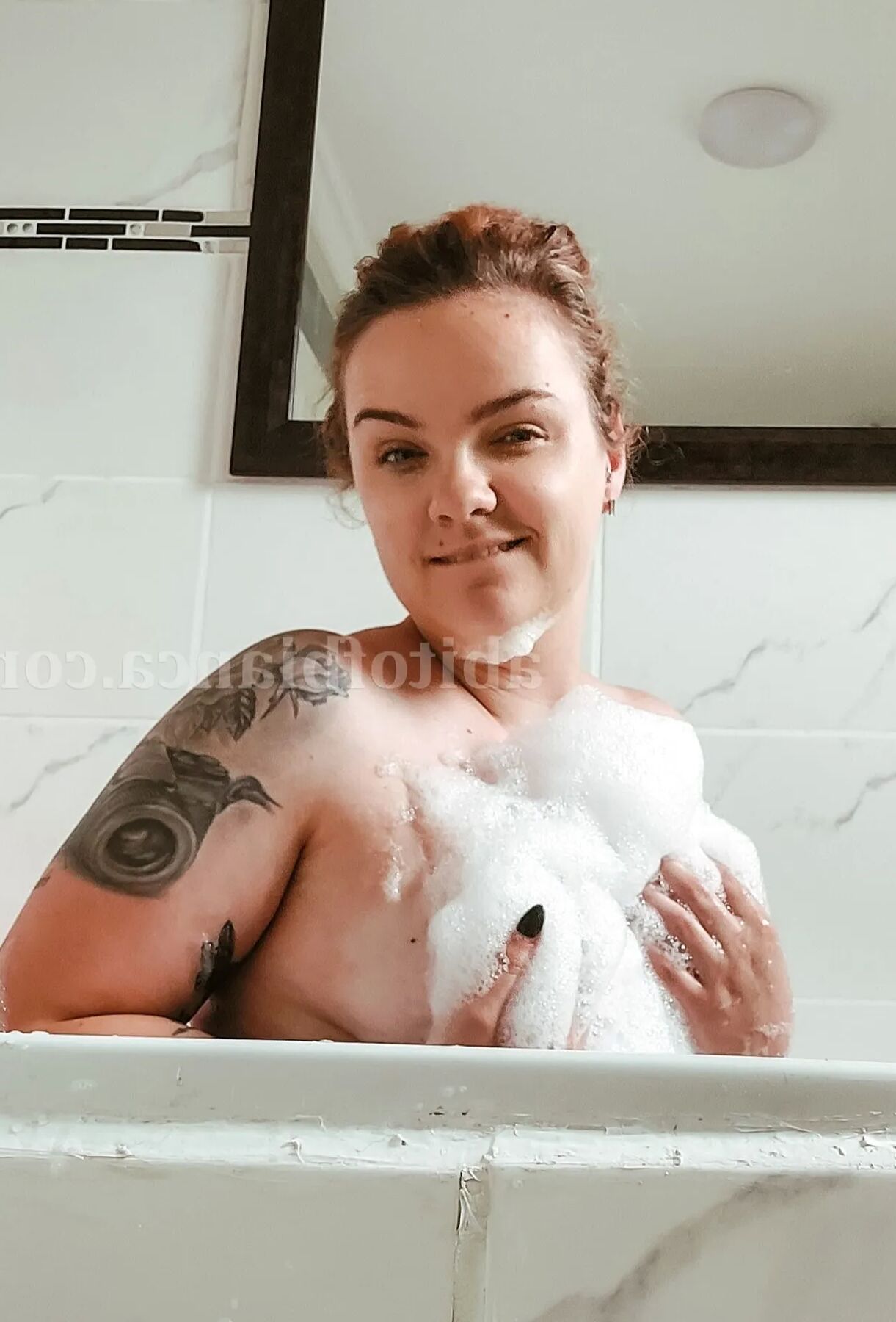 ABitofBianca hot tattooed redhead playing in a bubble bath