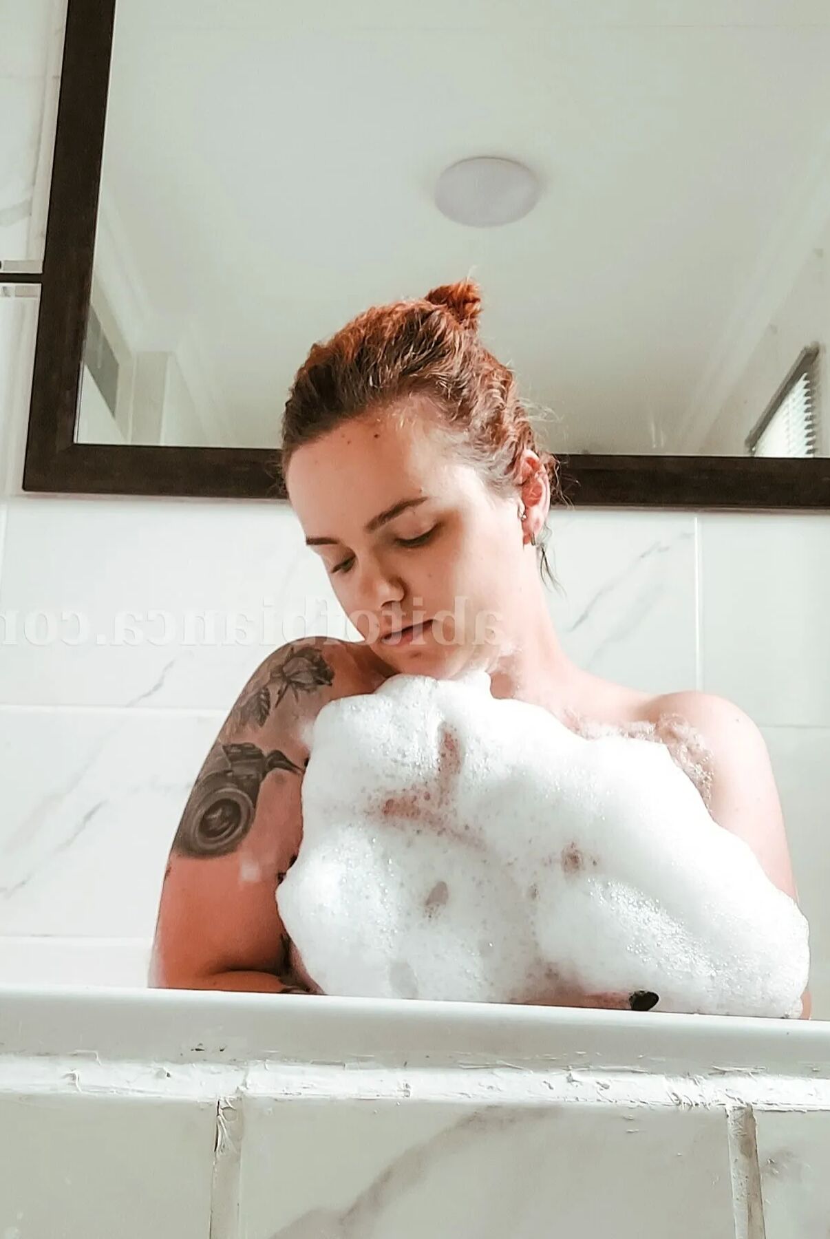 ABitofBianca hot tattooed redhead playing in a bubble bath