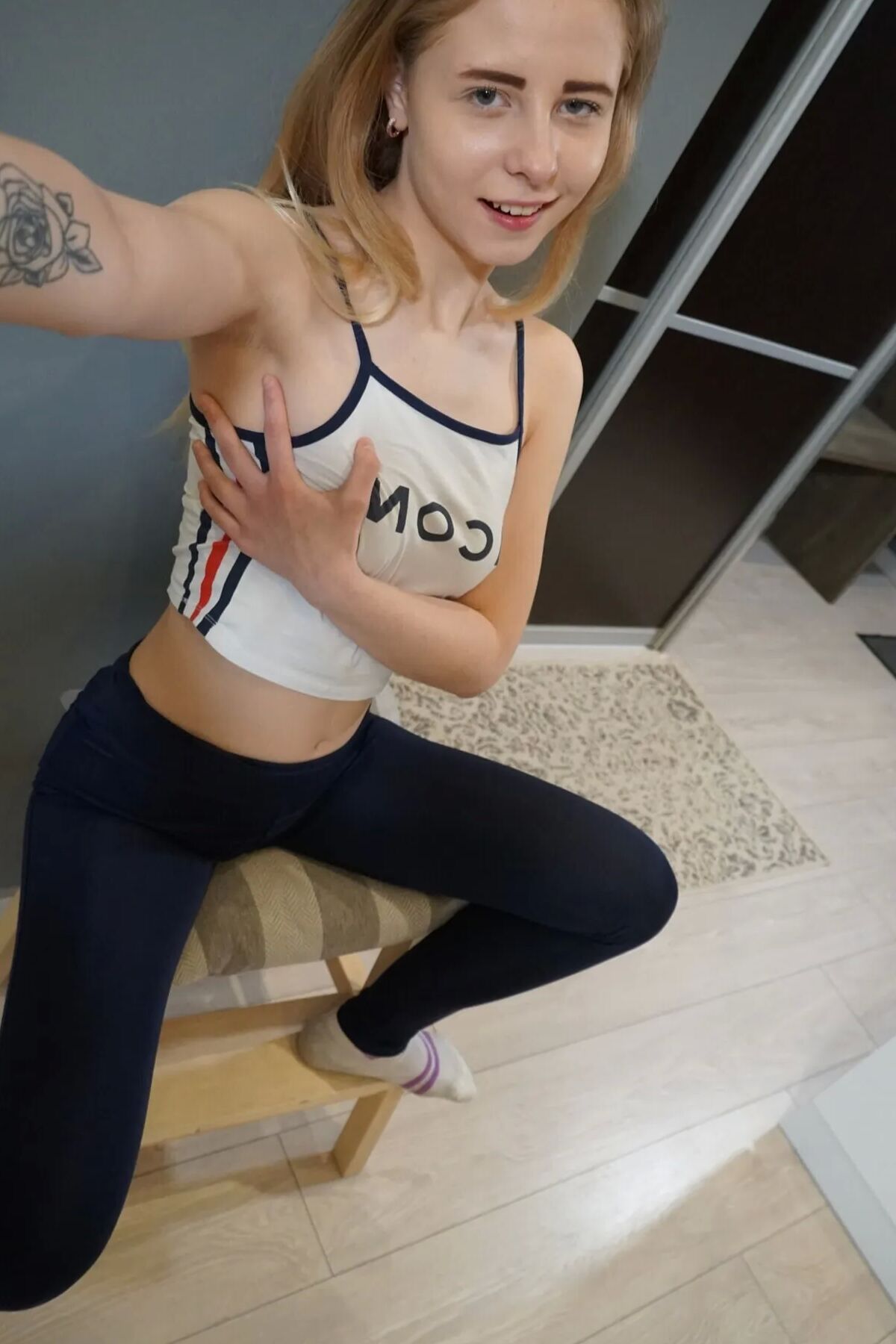 Petite perky girl takes nudes while smiling