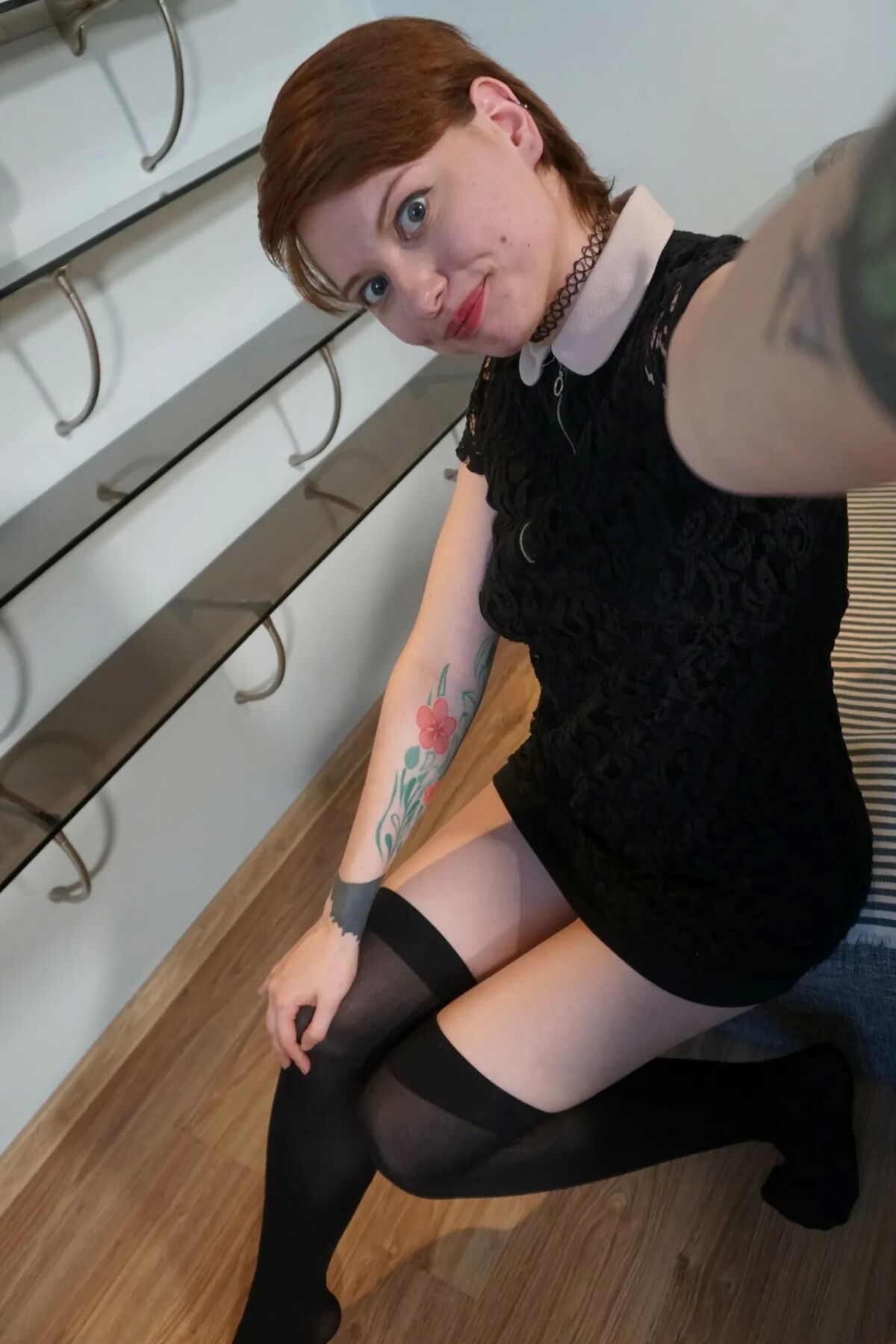 Sweet redhead gets naked in the office