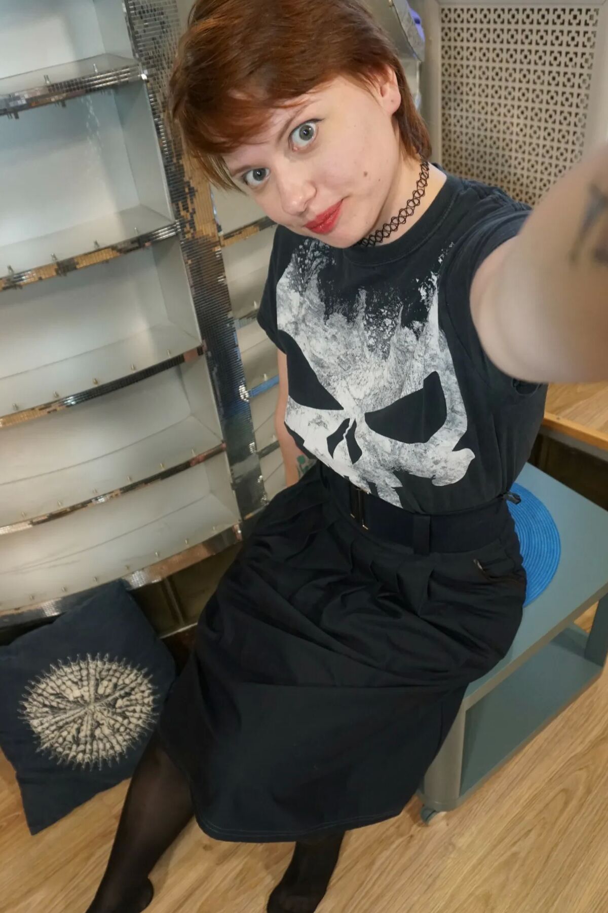 Sweet redhead gets naked in the office