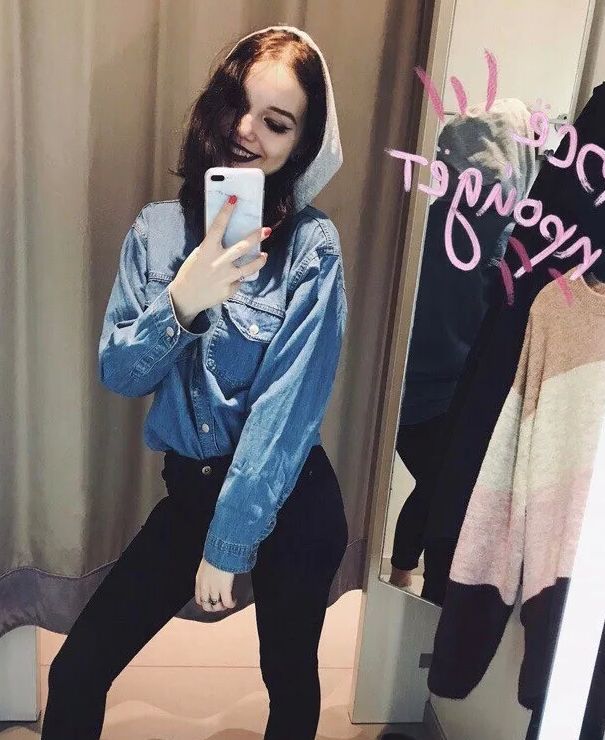 Long-haired teen loves to pose and take nudes